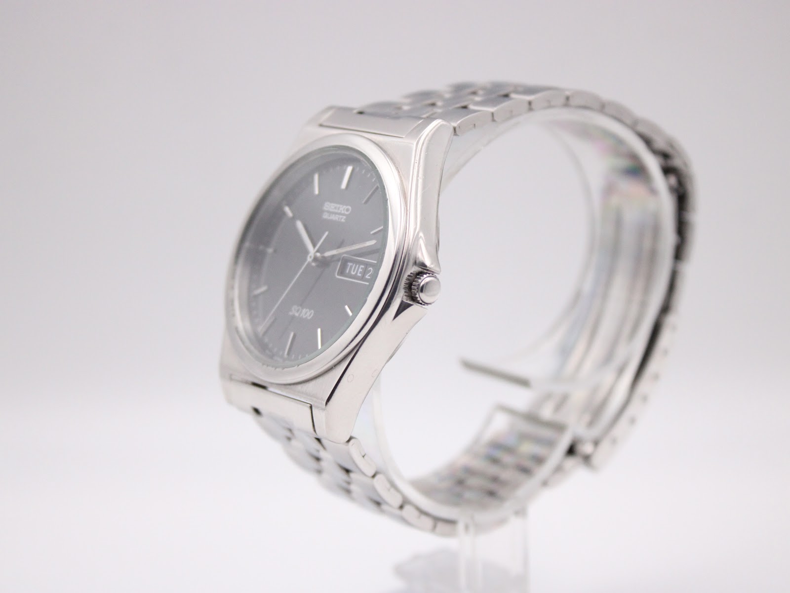 Angled side view of the Seiko quartz watch showing the case profile and crown.