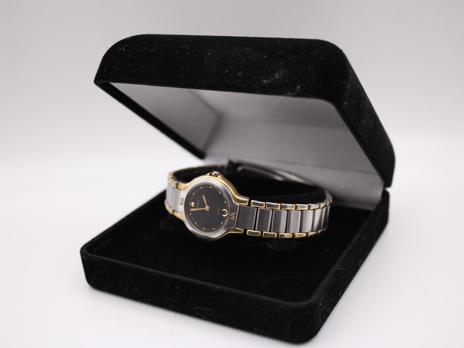 The Seiko Creo watch presented inside a black velvet display box against a white background.