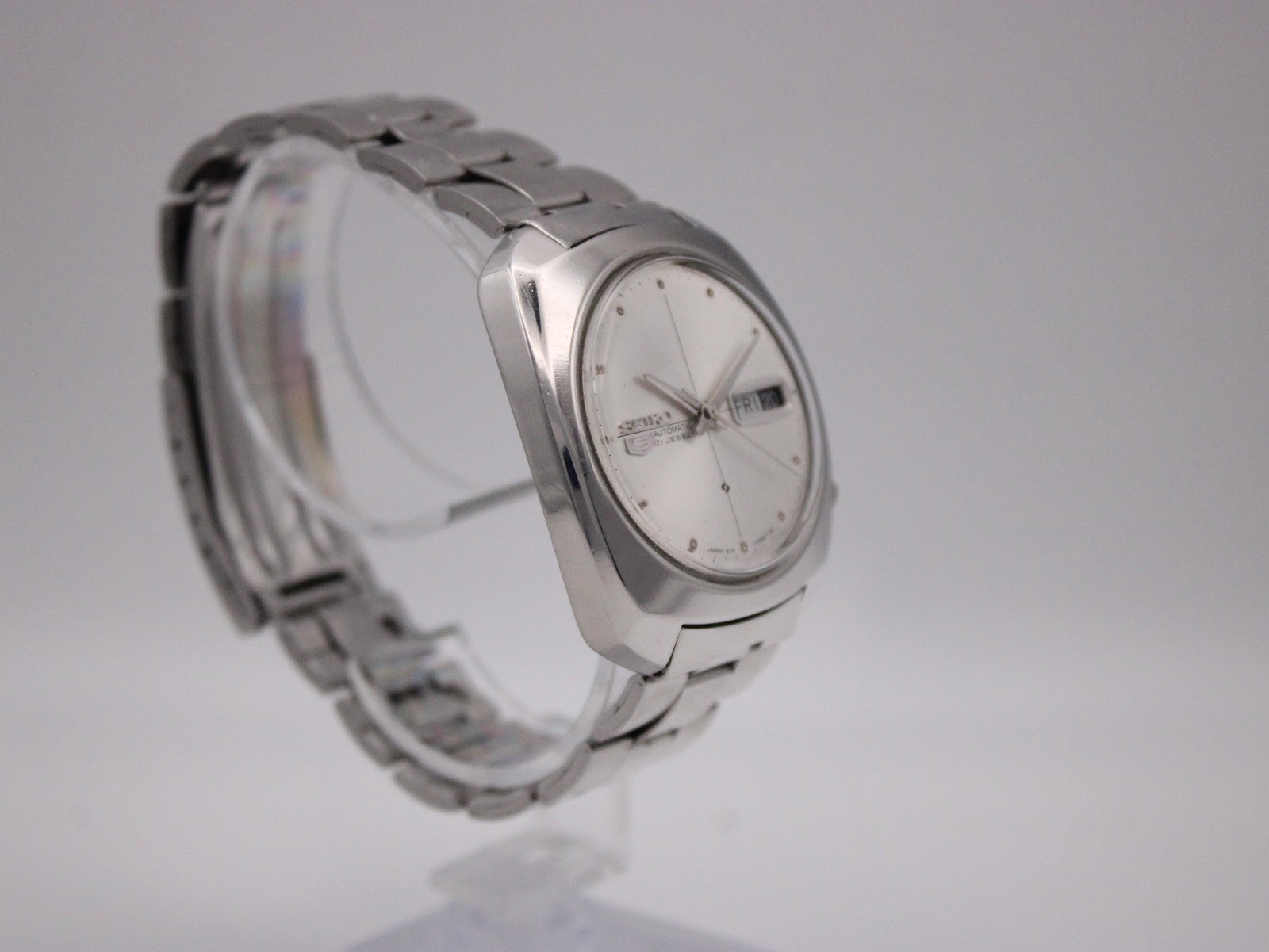 Another angled side view of the vintage Seiko watch, highlighting the cushion case profile and integrated bracelet design.