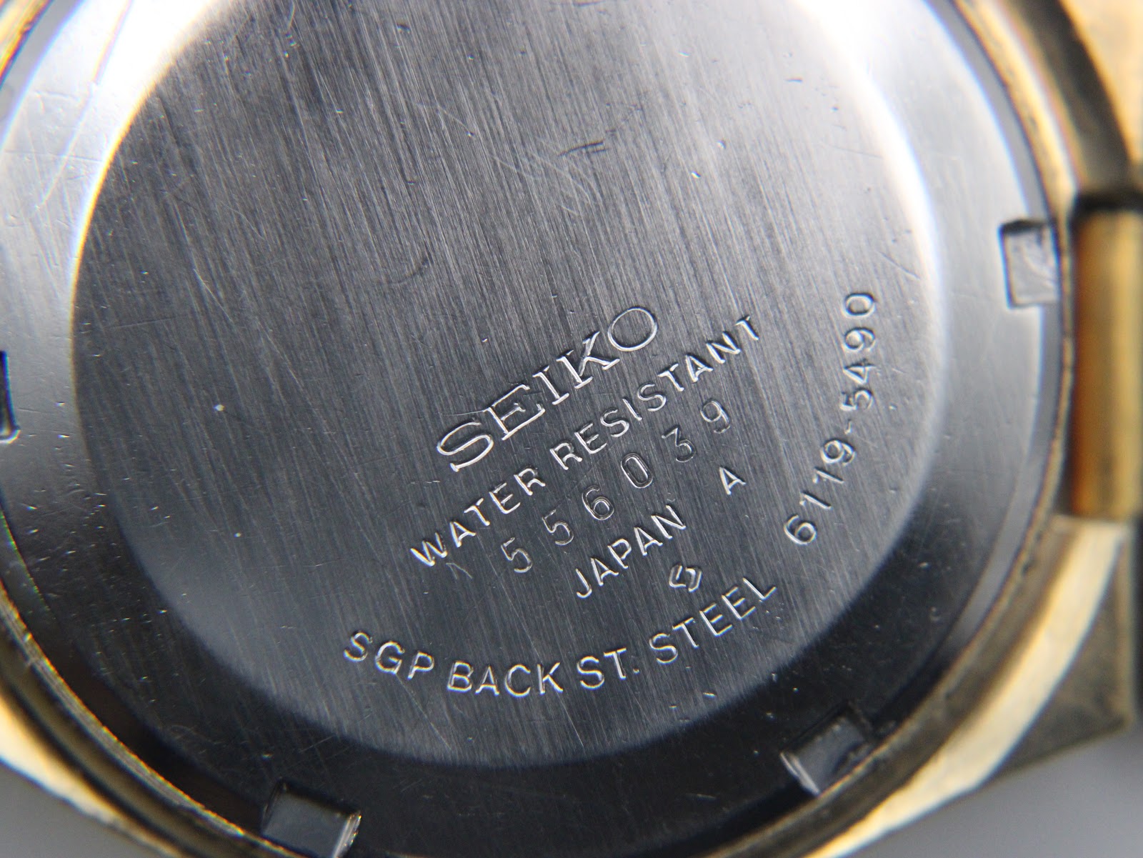 Detailed view of the Seiko 6119-5490 dial, highlighting the day-date window and applied indices.