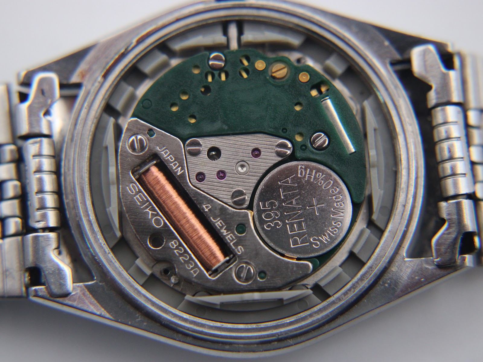 Macro view of the Seiko 8223A quartz movement, showing the 4 jewels and a newly fitted Renata 395 battery.