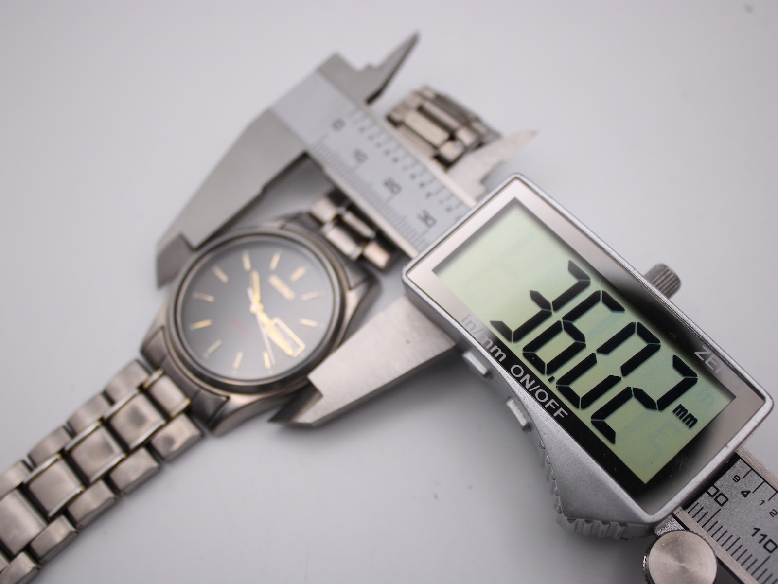 Digital caliper measuring the Seiko watch case diameter as 36.27mm.