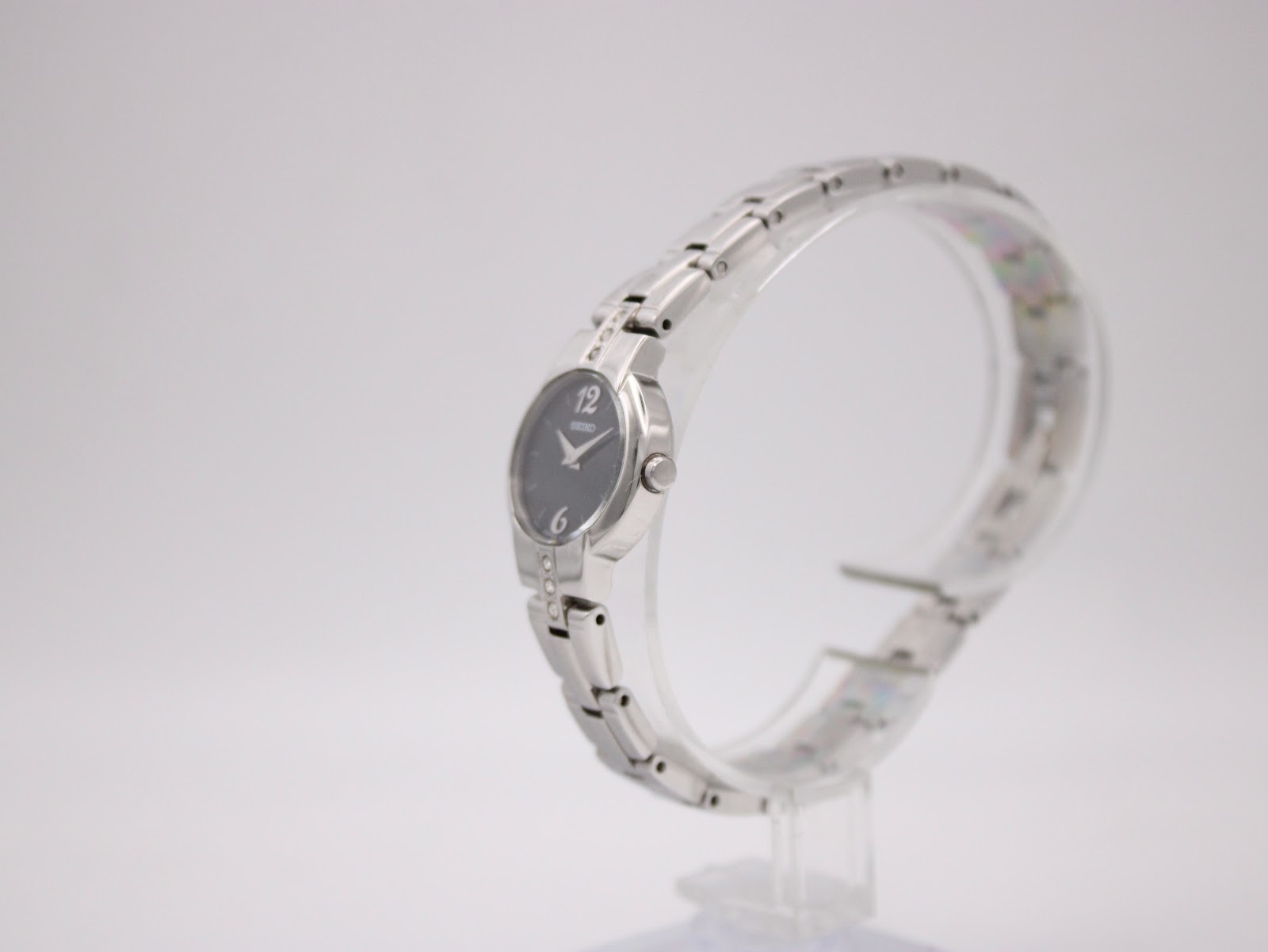 Angled side view of the Seiko ladies' watch, highlighting the polished stainless steel case and bracelet.