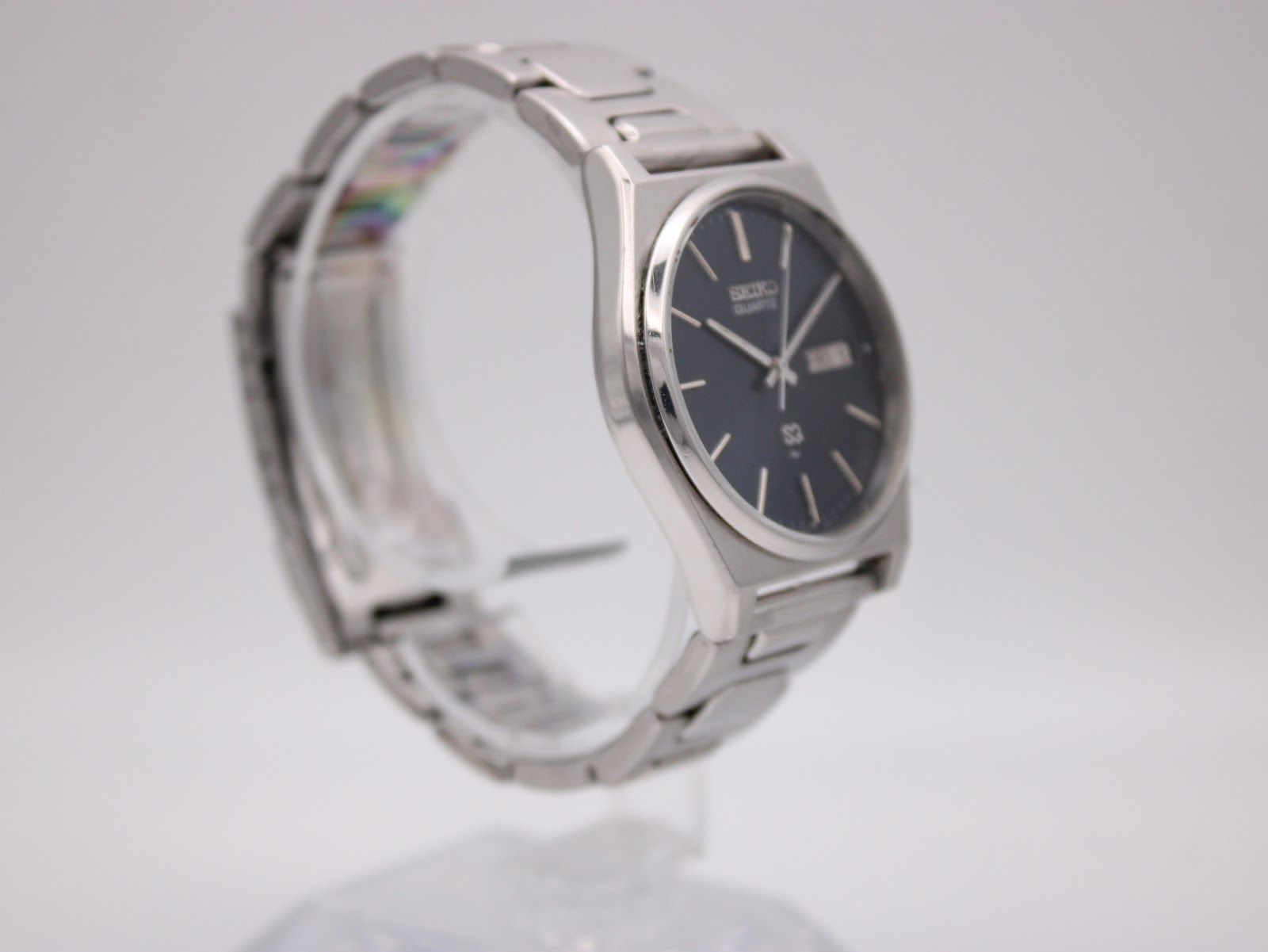 Close-up of the stainless steel integrated bracelet and fold-over clasp.