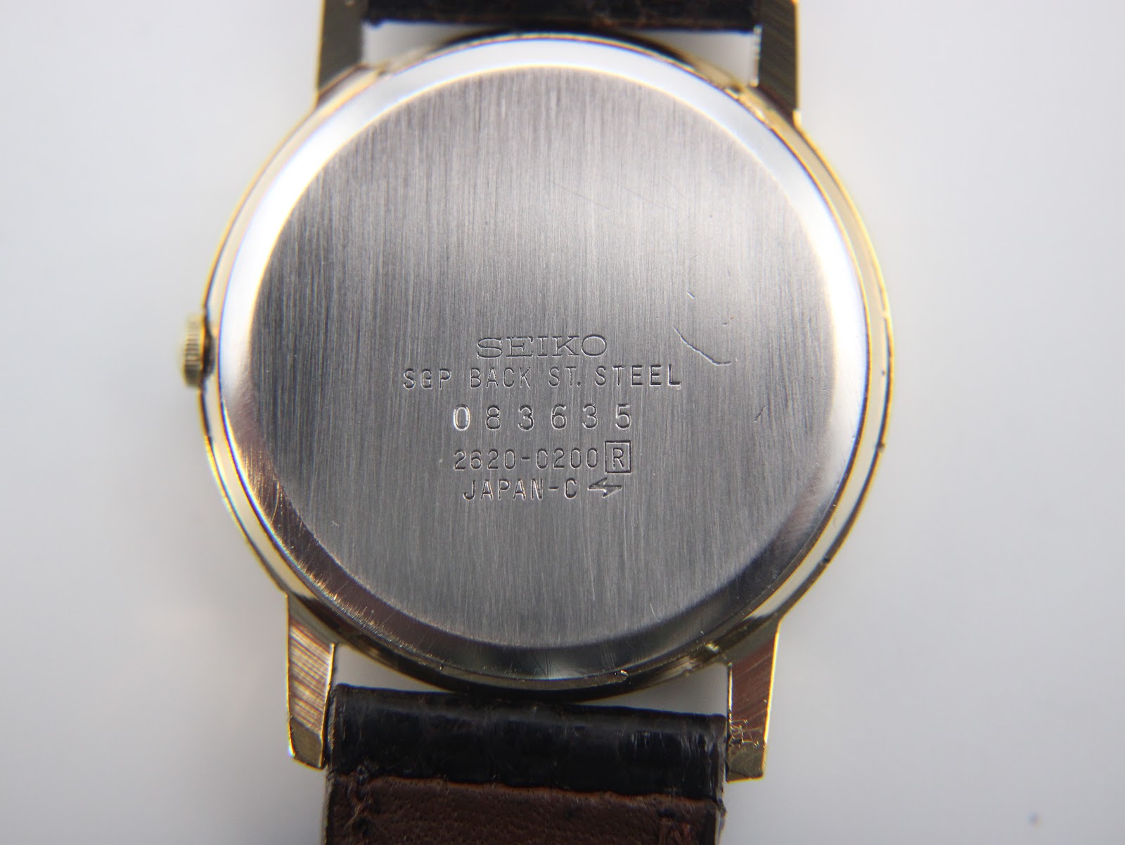 Close-up of the stainless steel case back with Seiko markings and serial number.