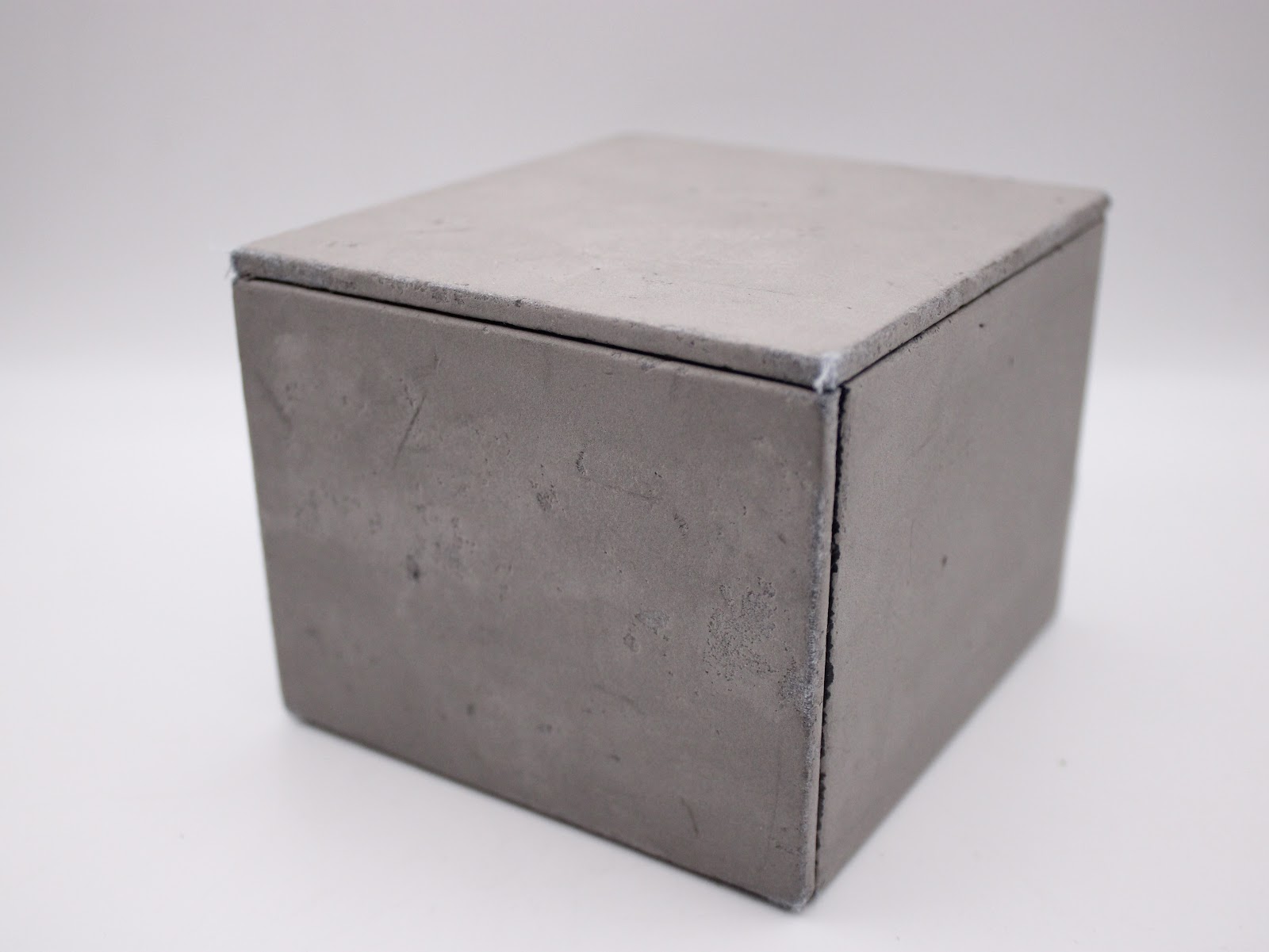 Closed view of the grey Gc watch box from the top corner.