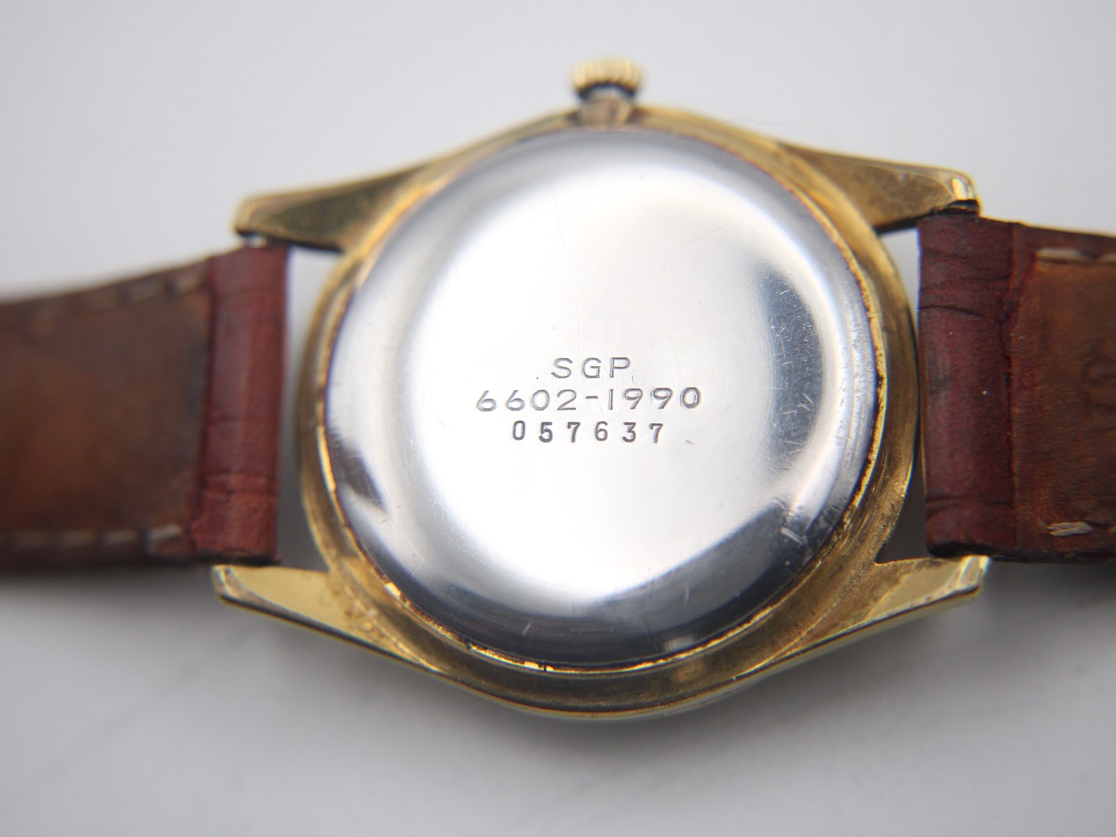 Case back view of the Seiko watch, showing 'SGP', '6602-1990', and serial number '057637' engravings.