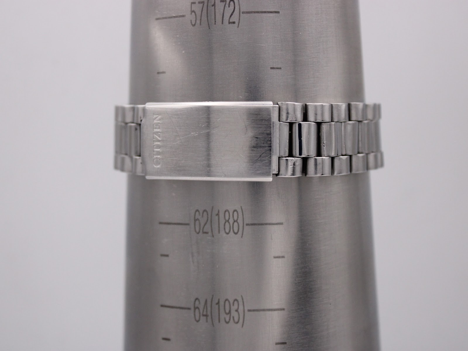 The stainless steel Citizen bracelet and signed clasp measured on a wrist sizing cone, indicating a circumference of 18.8cm (188mm).