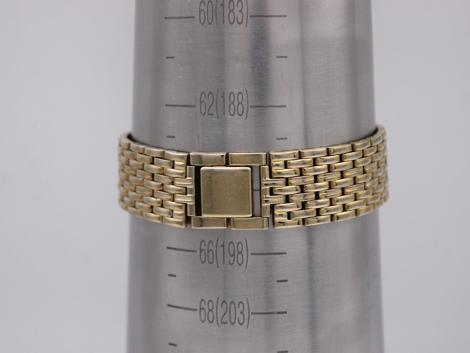 Gold tone steel bracelet of the Citizen watch on a wrist sizing gauge, showing a circumference of approximately 188mm.