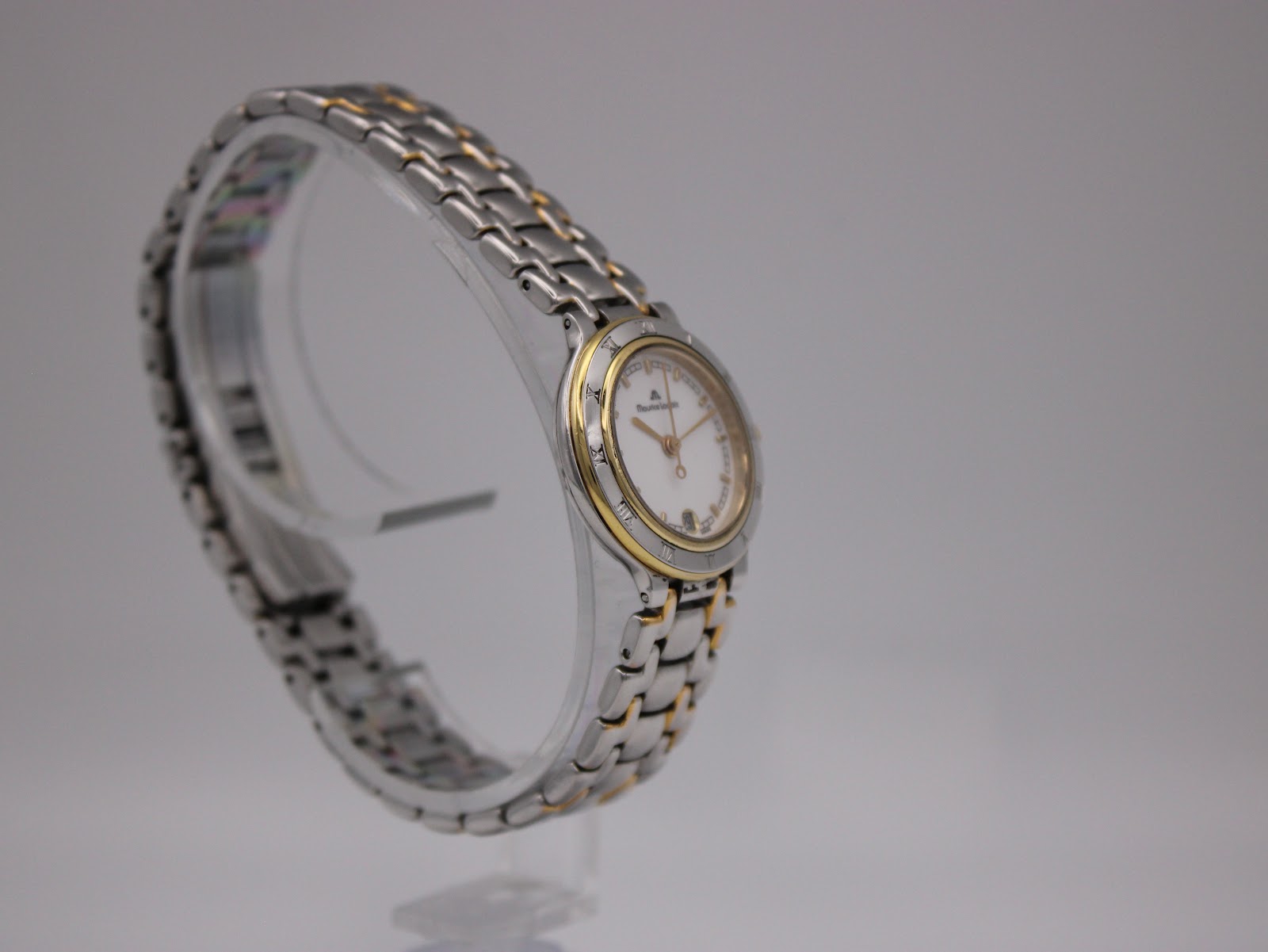 Another angled side view of the watch, highlighting the two-tone case and bracelet design.