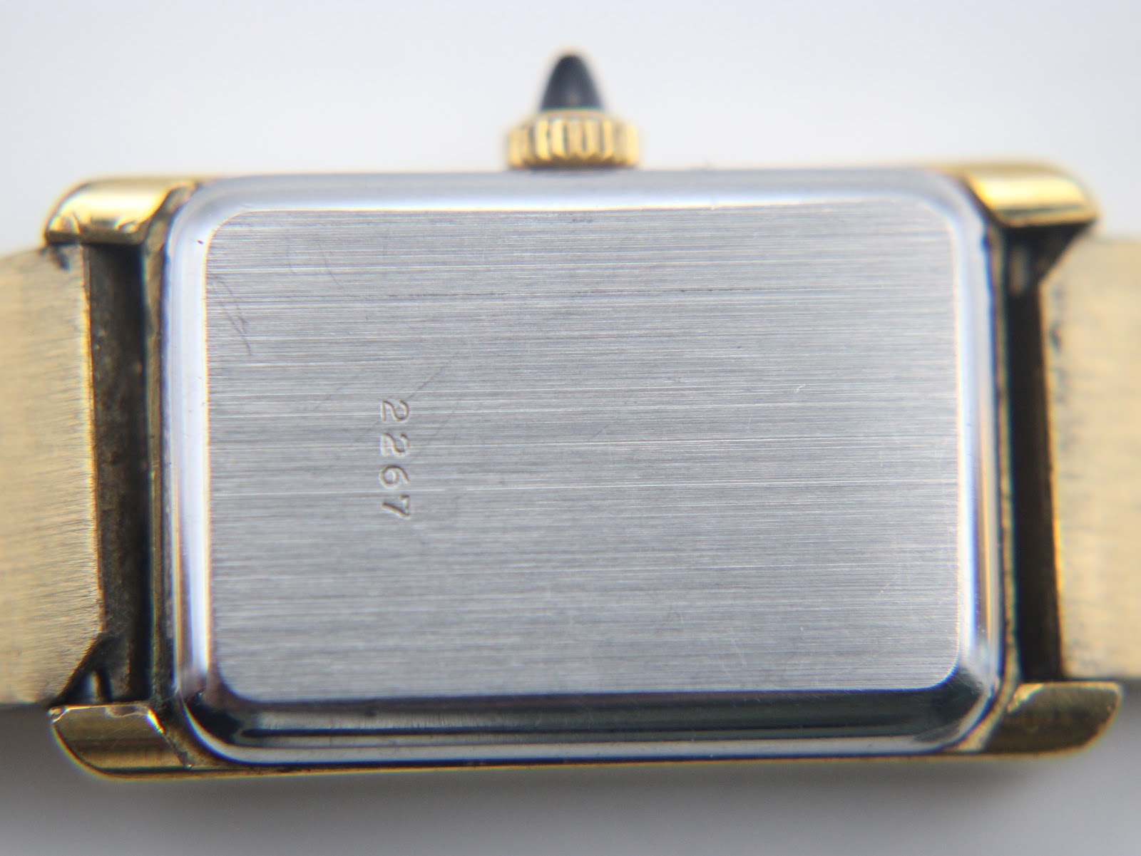 Close-up of the brushed stainless steel case back with the model number '2267' engraved.