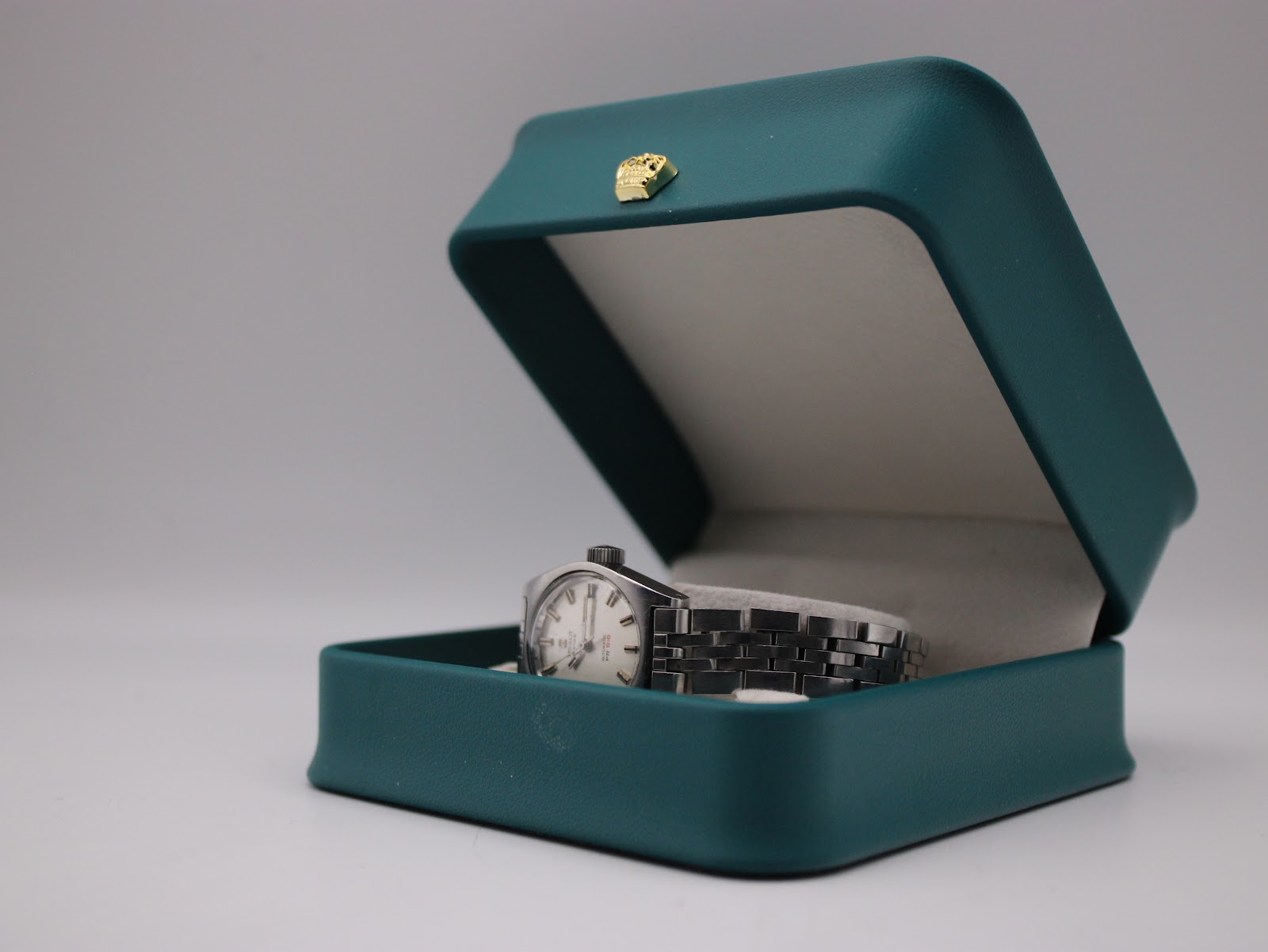 The Tissot PR 516 watch displayed inside a generic green presentation box, suggesting potential gift presentation.