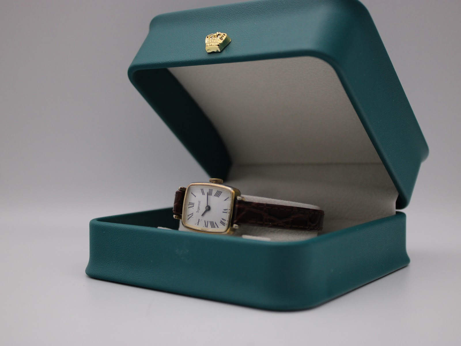 The Ingersoll watch presented inside a teal display box with a crown emblem (box shown for display purposes only, not included).
