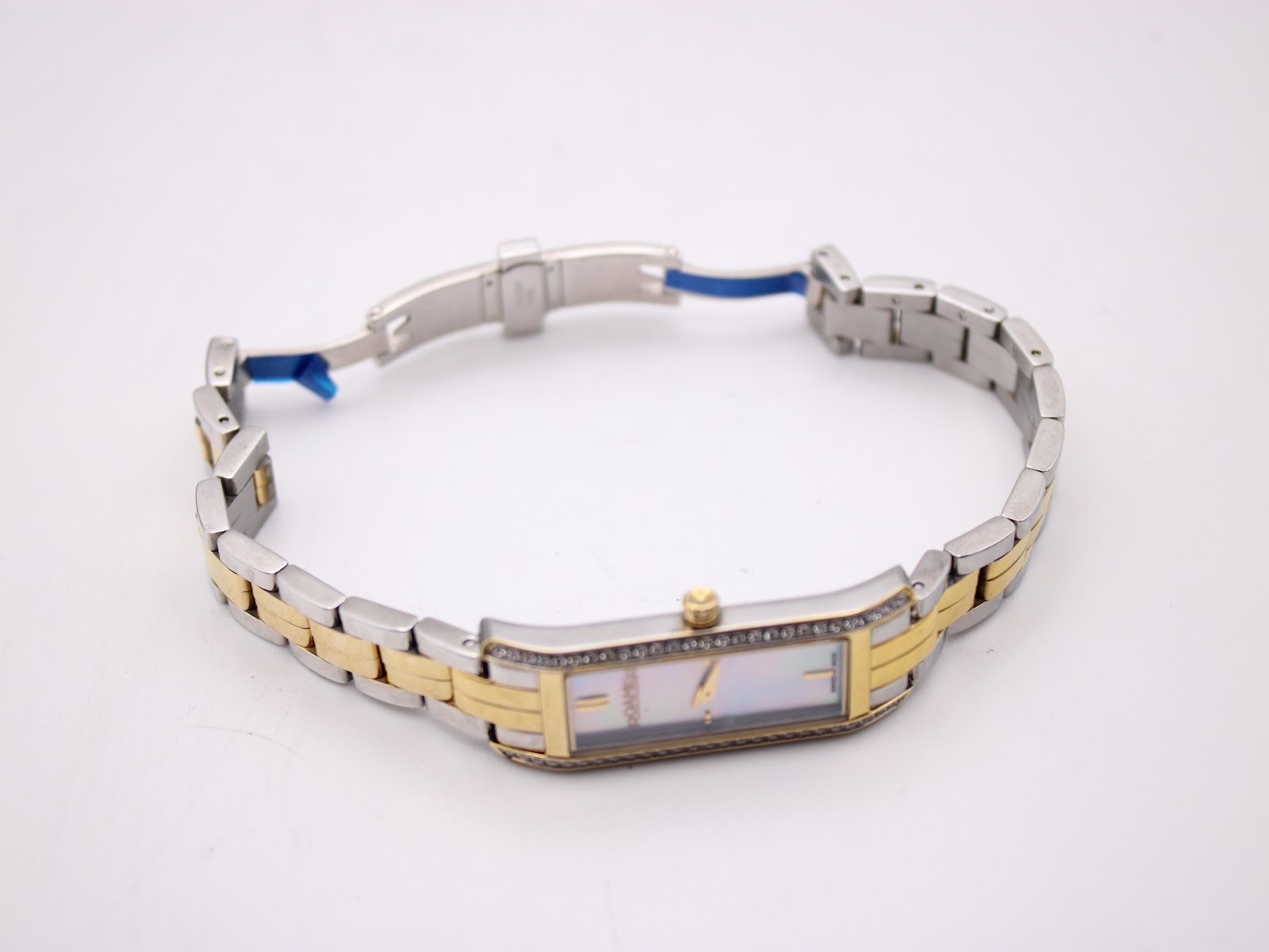 View of the Roamer Dreamline watch with its two-tone bracelet open, on a white background.