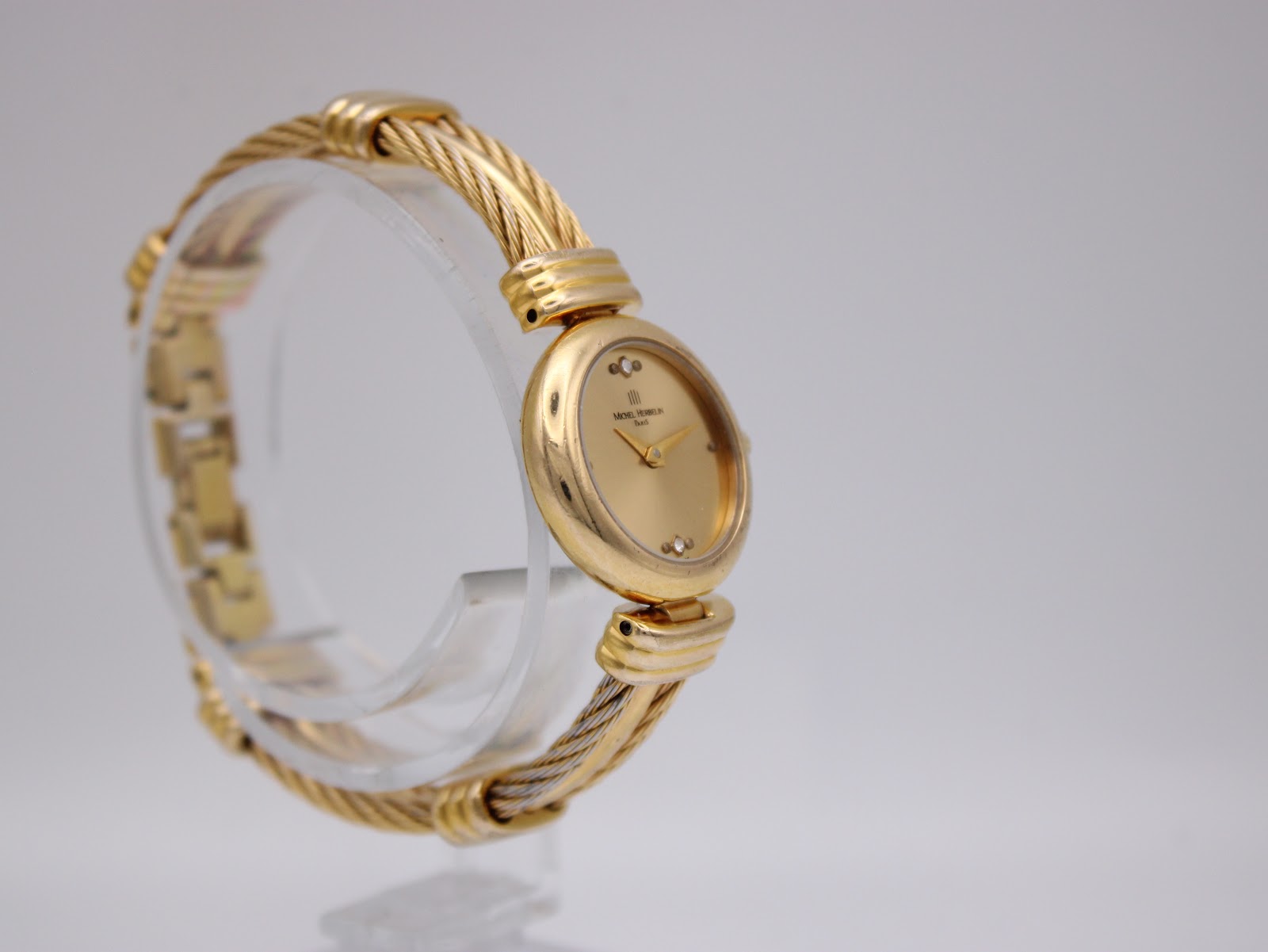 Angled right side view of the watch, showing the bracelet texture and case profile.