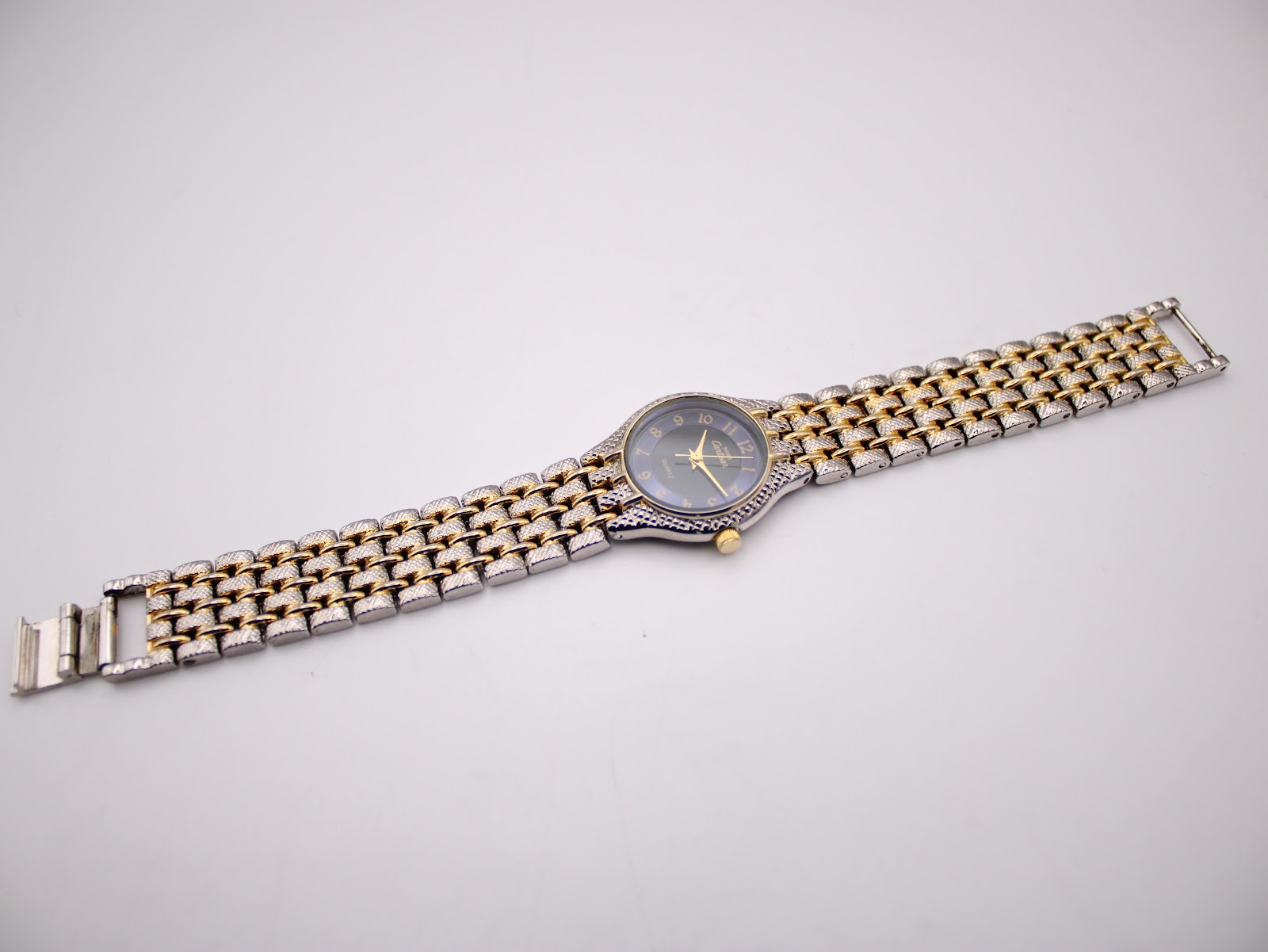 Full view of the Manin Cartear watch with the two-tone steel bracelet extended.