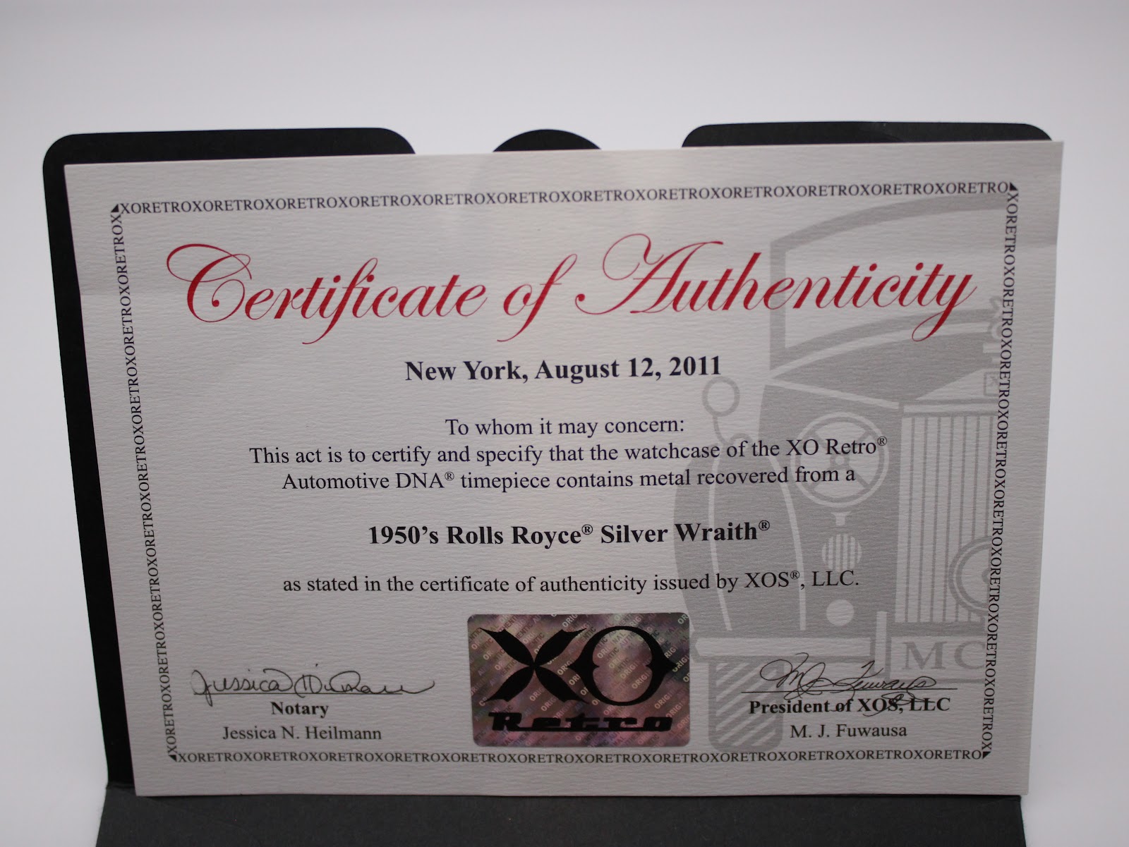 Certificate of Authenticity for the XO RETRO Automotive DNA watch, dated August 12, 2011, detailing that it contains metal recovered from a 1950's Rolls Royce Silver Wraith.