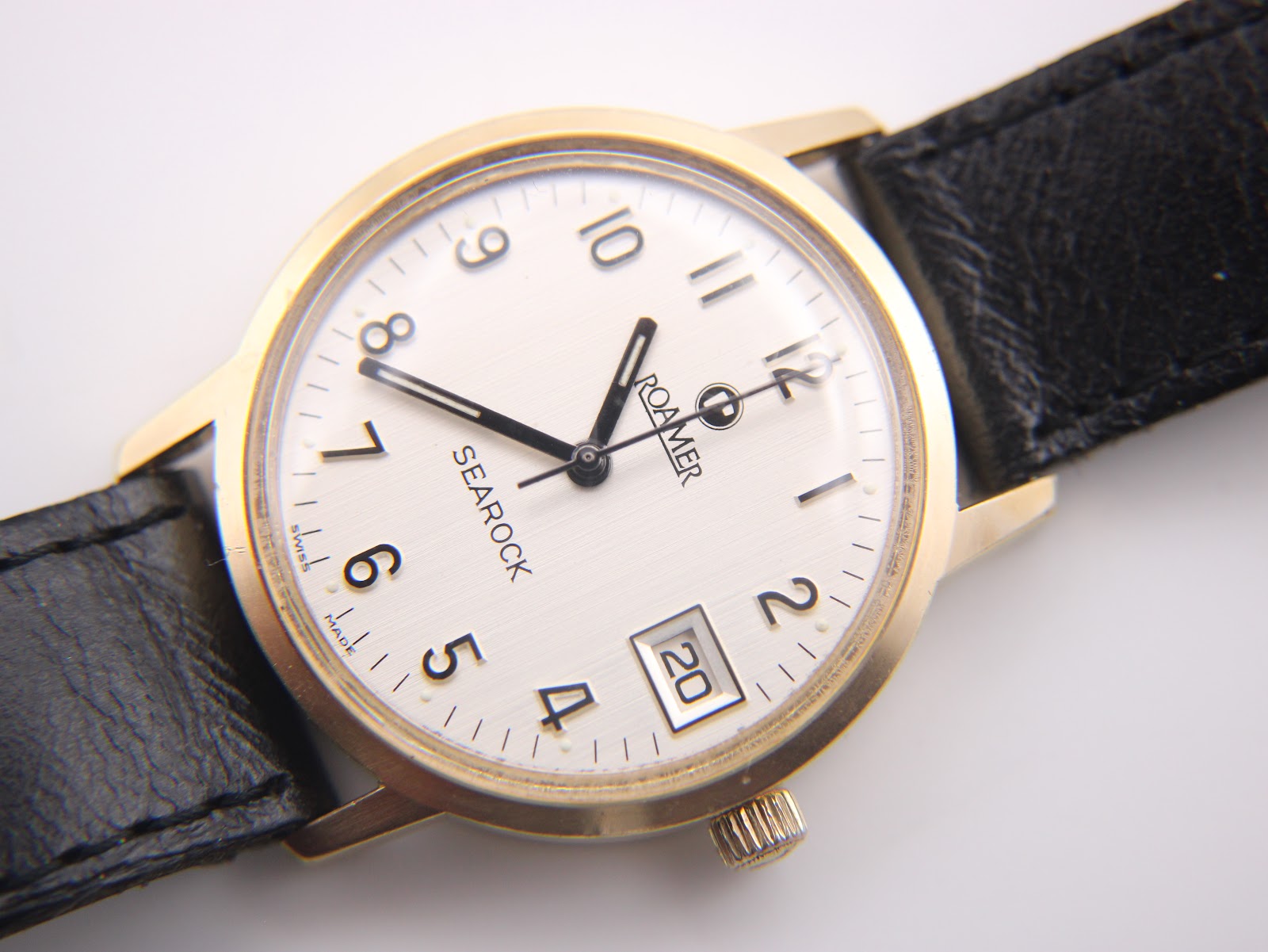 Angled close-up of the Roamer Searock dial, showing the date window at 3 o'clock and 'Swiss Made' at 6.