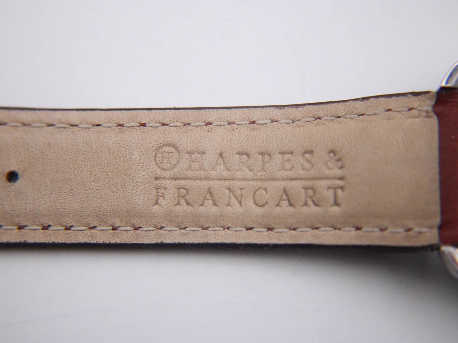 Inside view of the brown leather strap showing "Harpes & Francart" branding.