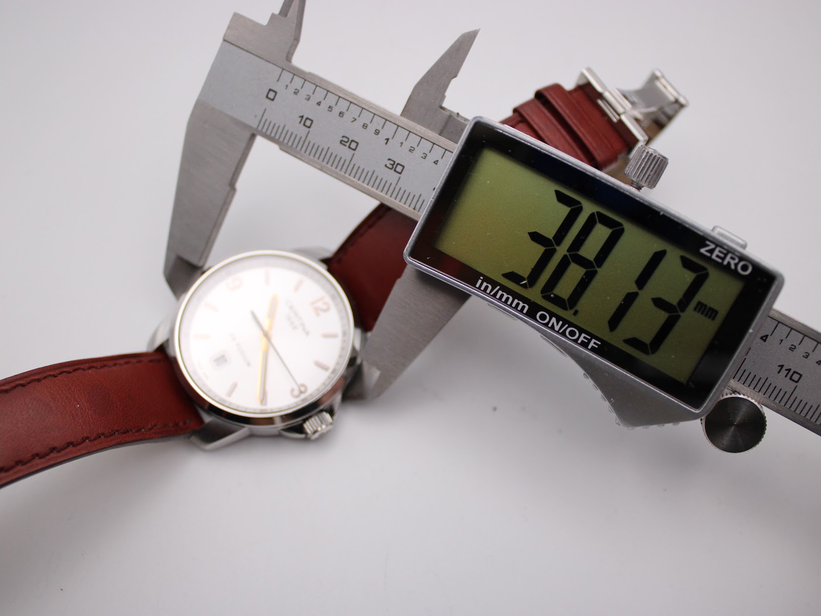 Digital caliper measuring the Certina DS Podium case diameter at precisely 38.13mm.