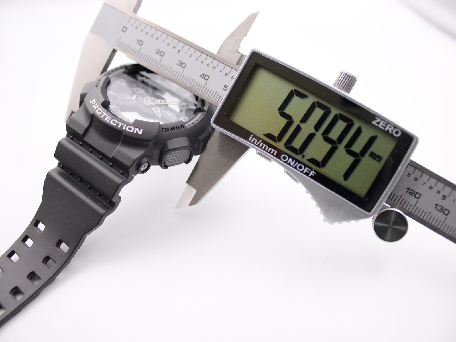 Digital caliper measuring the case diameter of the Casio G-Shock GA-110C, displaying 50.94mm.