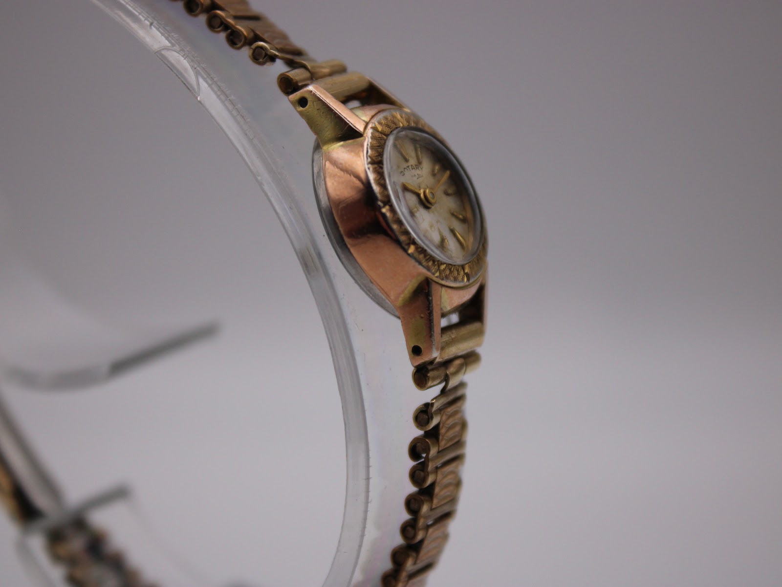 Another side profile view of the Rotary watch, highlighting the decorative bezel.