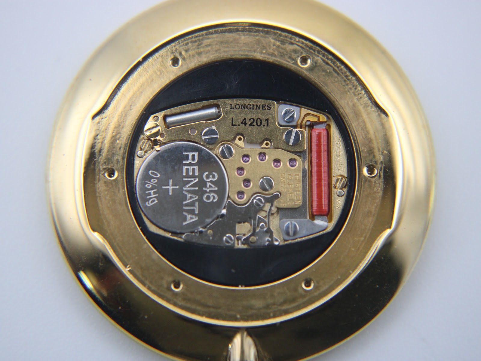 Close-up of the Longines L.420.1 quartz movement inside the watch, showing the Renata battery.
