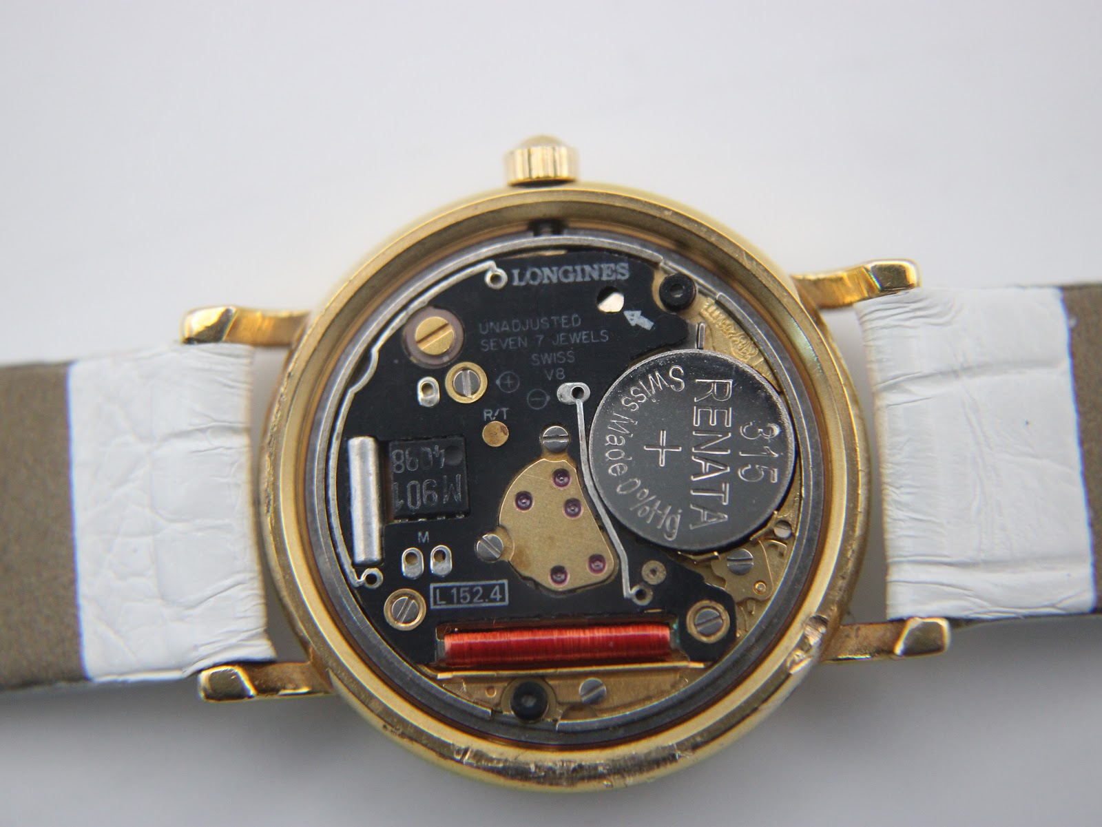 View of the Longines L152.4 quartz movement inside the watch, with a Renata battery visible.