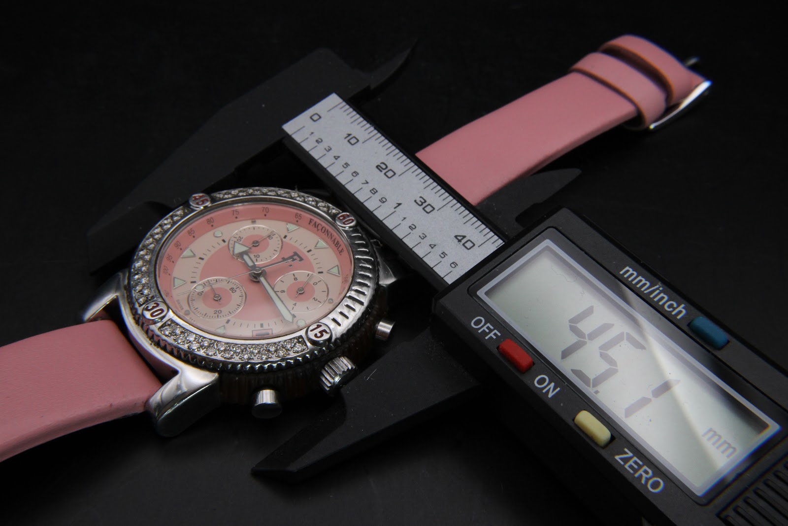Overhead view of the Façonnable watch with a digital caliper measuring the case diameter at 45.7mm.