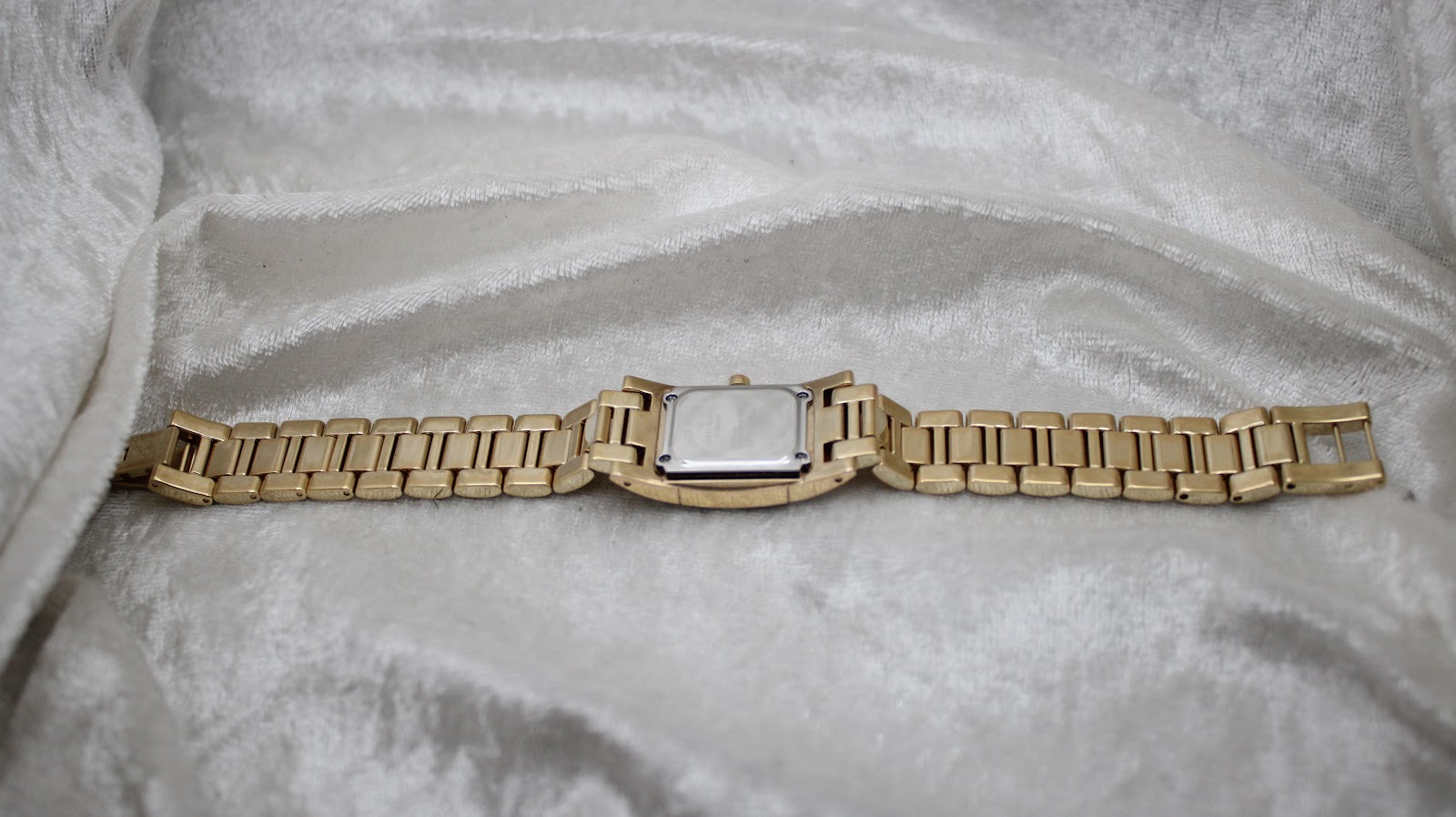 Underside view of the Ingersoll Diamond watch, showing the case back and the full length of the extended bracelet.