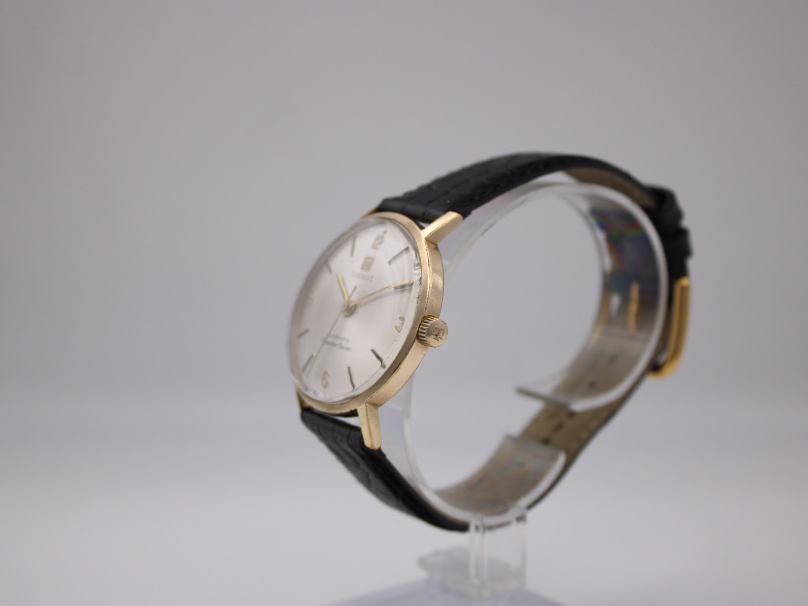 Side profile of gold-plated Tissot case with original signed crown.