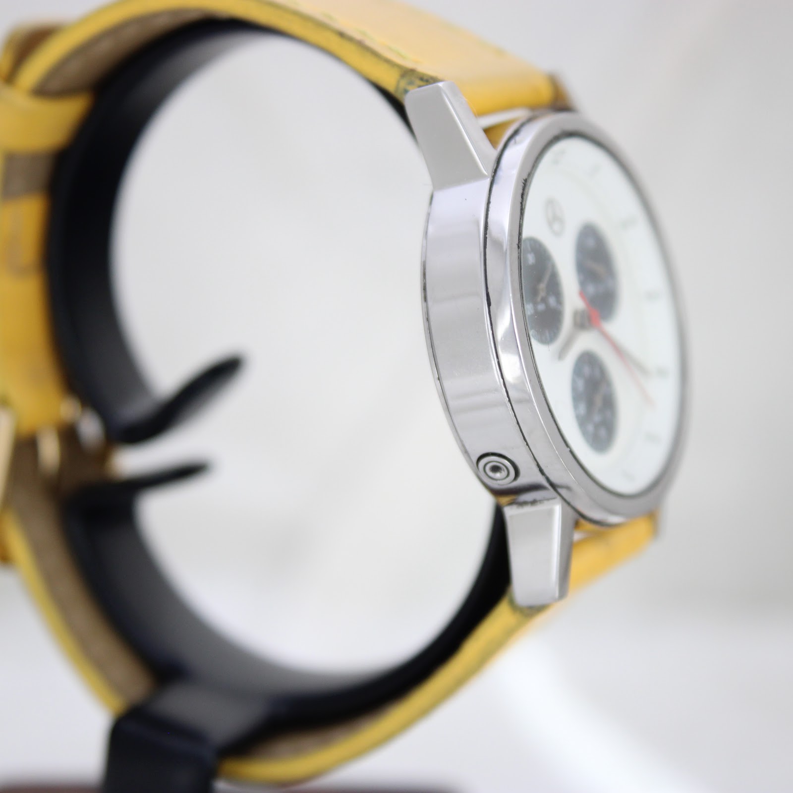Opposite side view of Mercedes-Benz SLK watch case, highlighting the smooth metal finish.