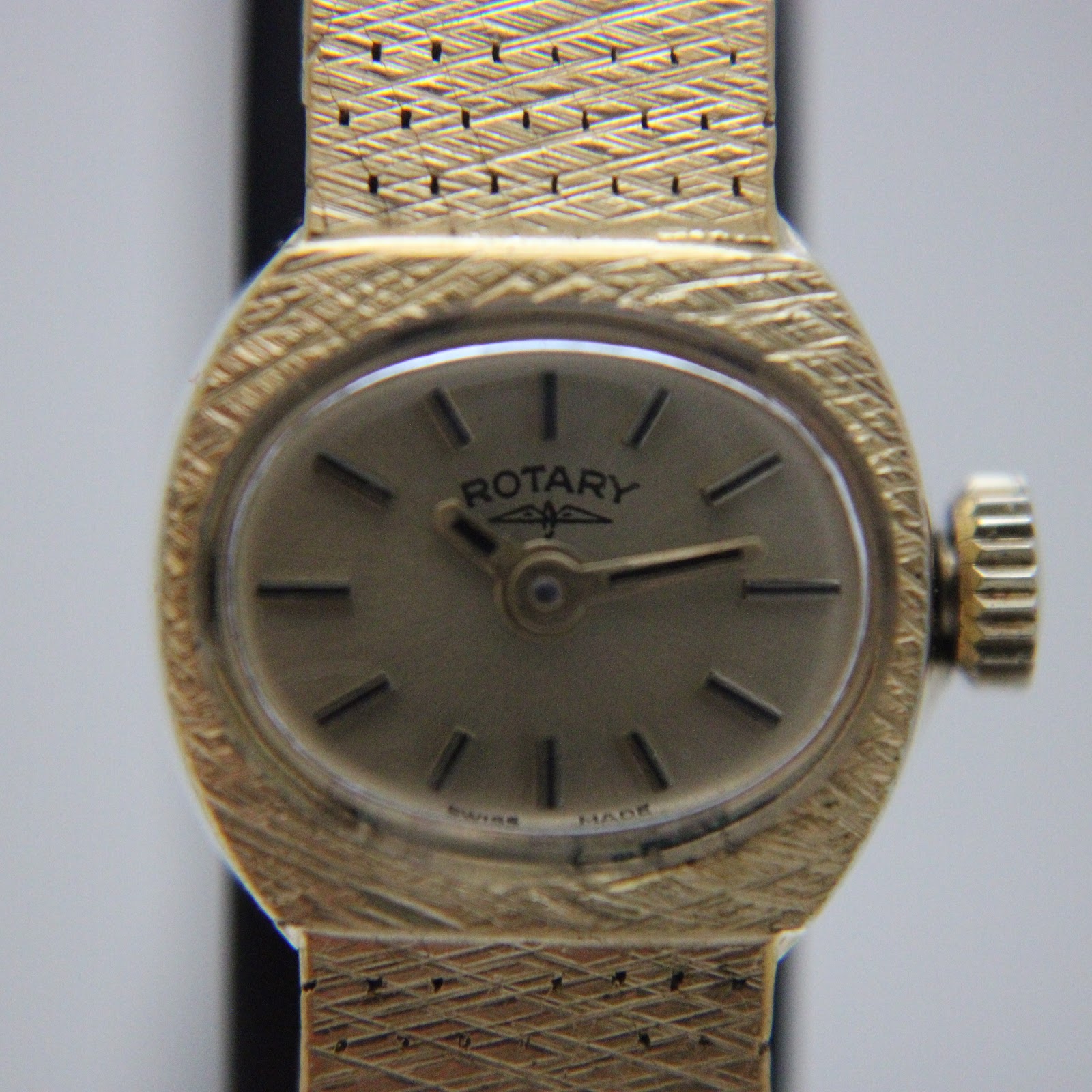 Close-up front view of the Rotary dial with 'Rotary' logo, 'Swiss Made' text, and baton indices.