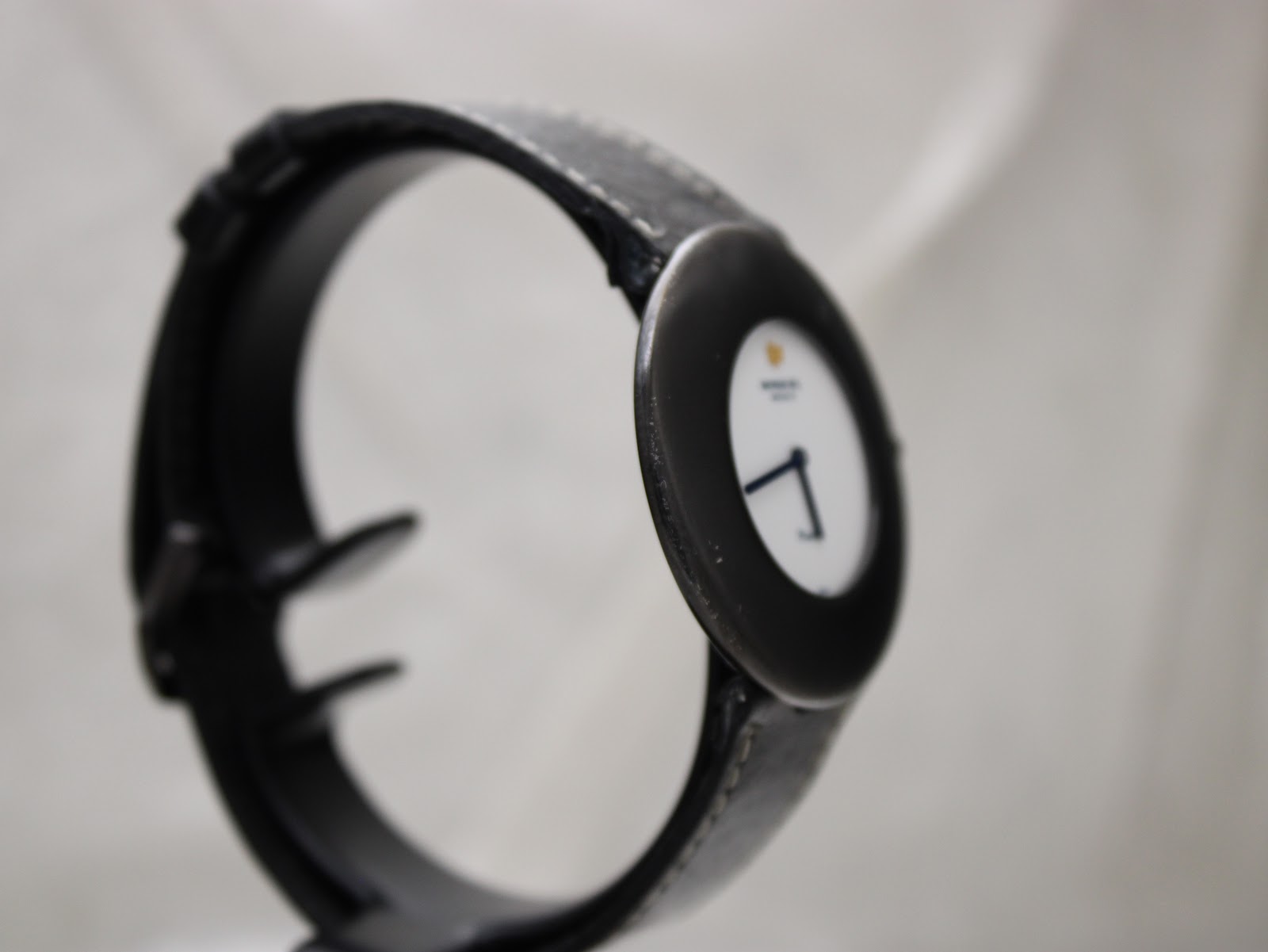 Another side angled view of the Phantôm watch, highlighting the case profile and black leather strap.