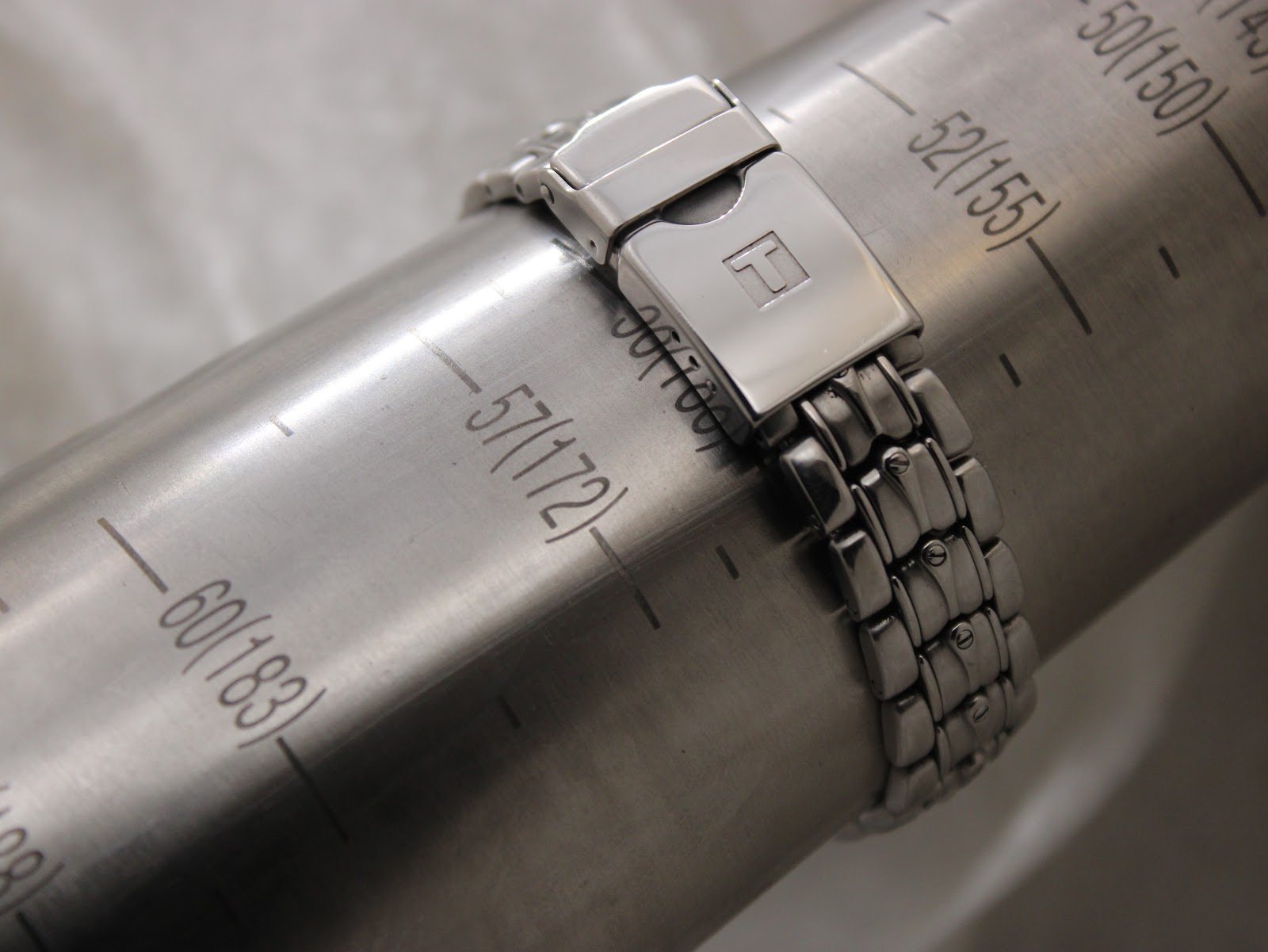 Tissot PR 200 watch bracelet on a wrist sizing gauge, indicating a maximum wrist circumference of approximately 172mm / 17.2cm.