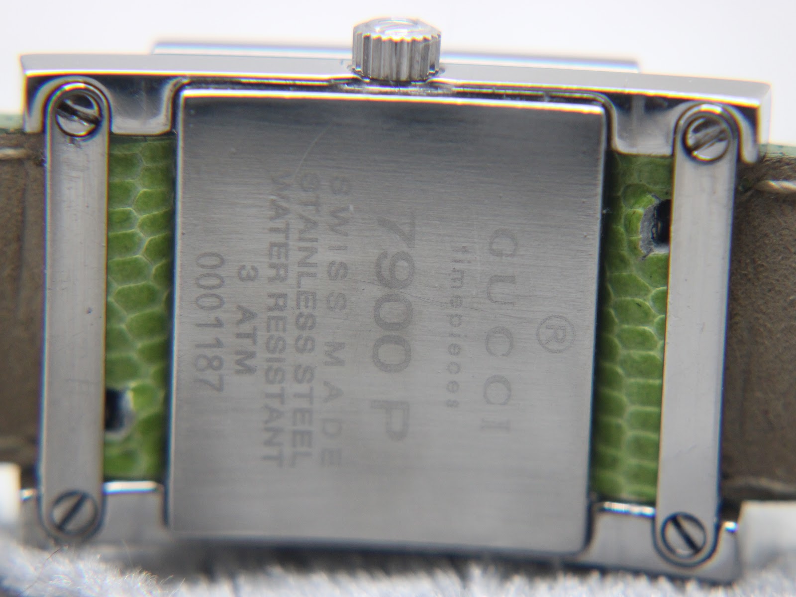 Close-up view of the brushed stainless steel case back of the Gucci 7900P, showing "Swiss Made", "Stainless Steel", "Water Resistant 3 ATM", "7900 P", and serial number.