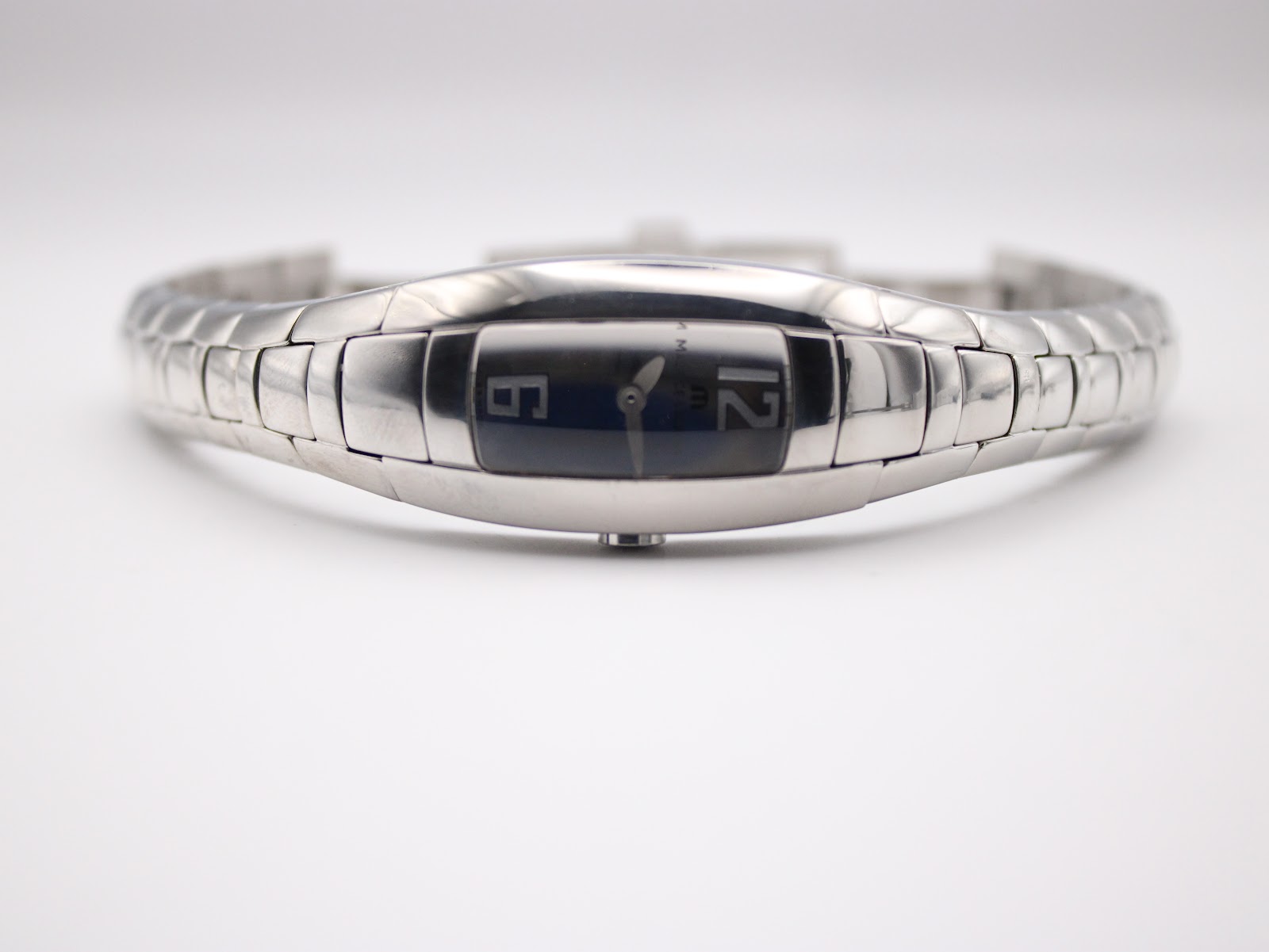 Front view of the Maurice Lacroix watch dial from a lower angle, showing reflections on the sapphire crystal and the silver dial.