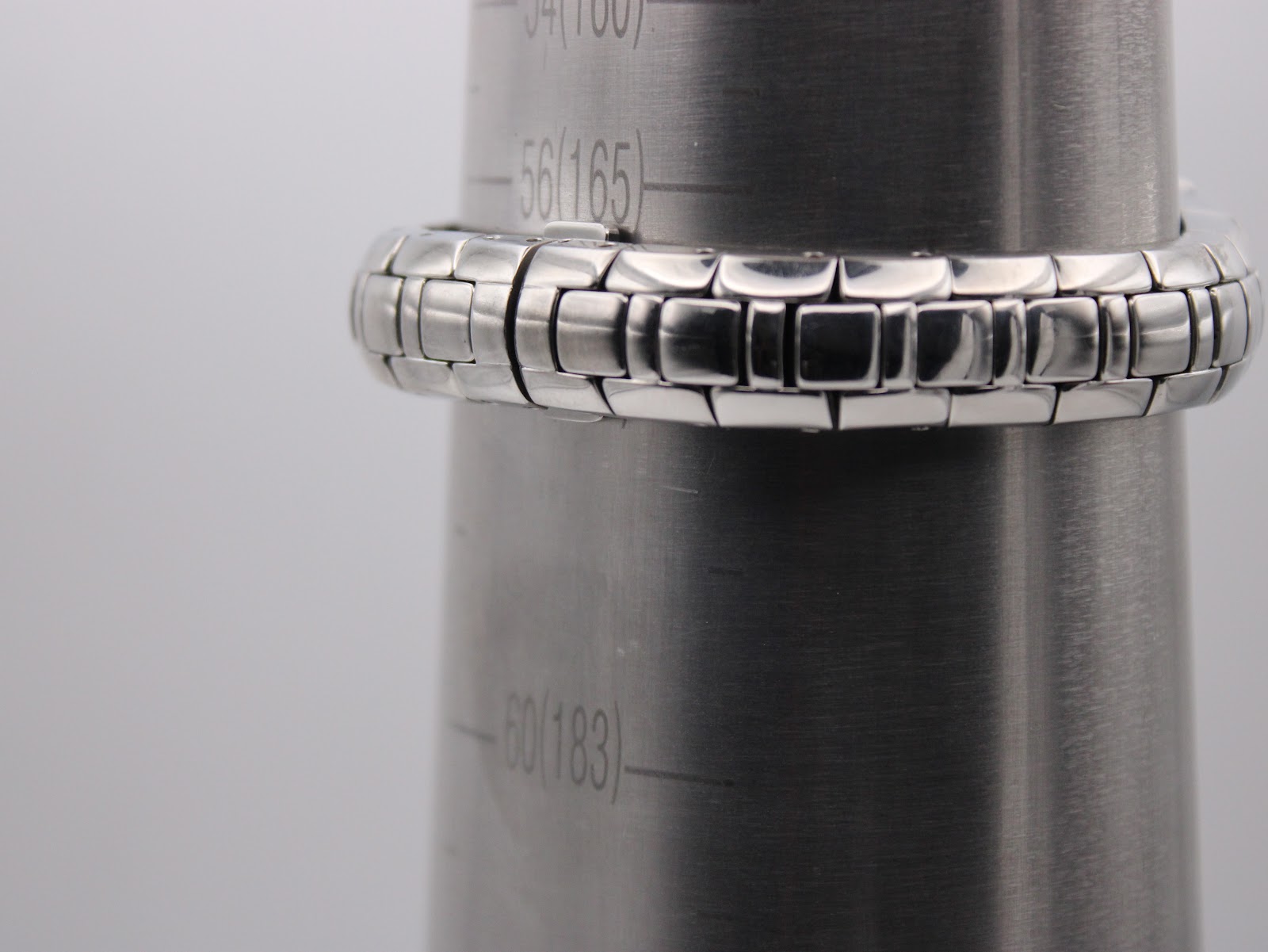 Maurice Lacroix watch bracelet wrapped around a wrist sizing gauge, indicating a wrist size of approximately 165mm, consistent with reference stated 172mm.