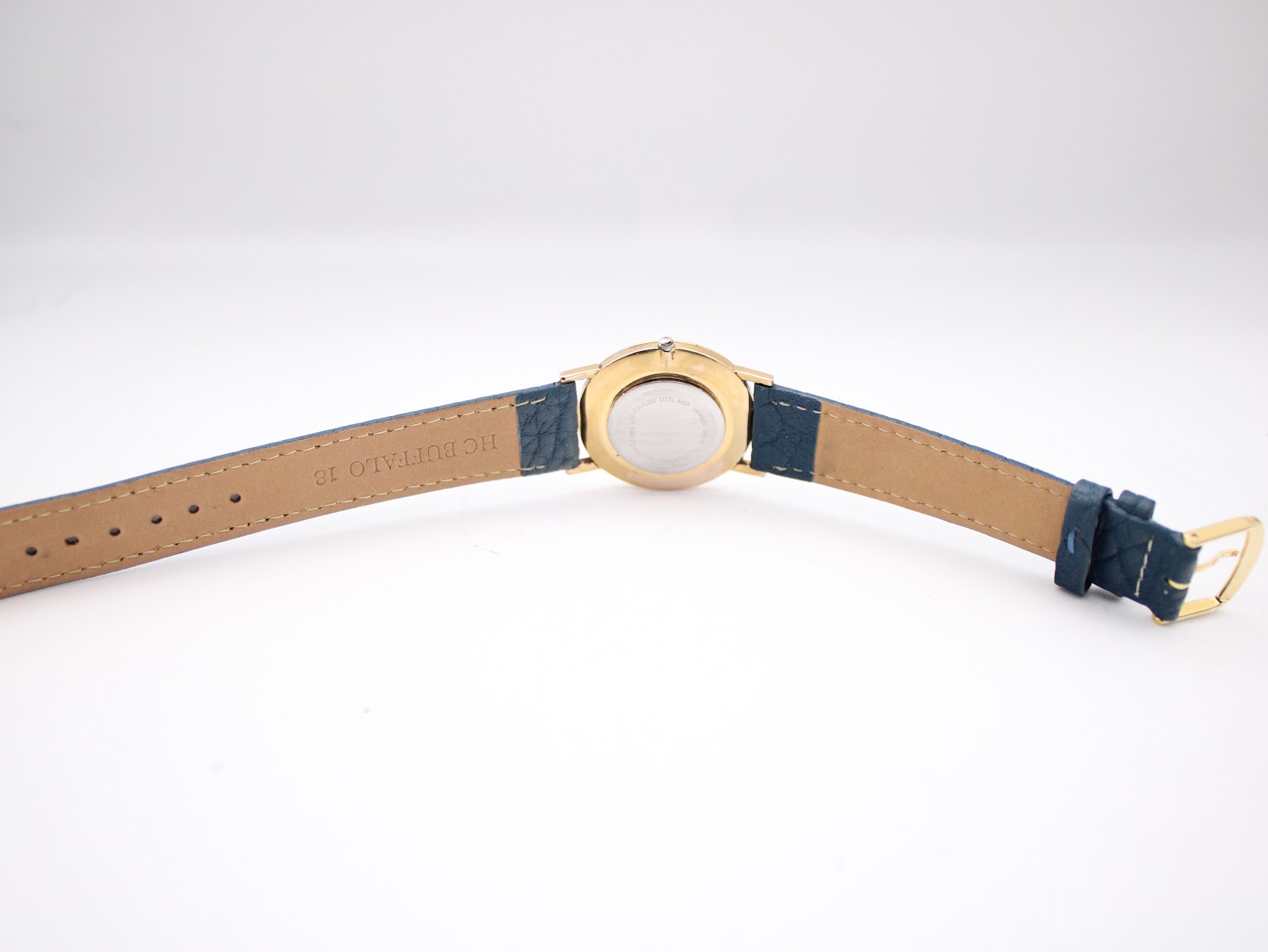 Back view of the Certina watch strap, showing the light brown underside and 'HC BUFFALO 16' marking.