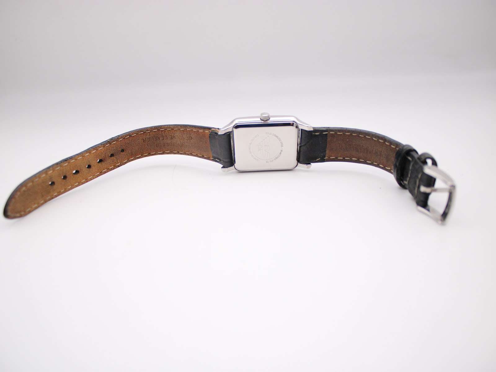 Rear view of the Emporio Armani AR-0413 watch lying flat, showing the underside of the strap and the case back.