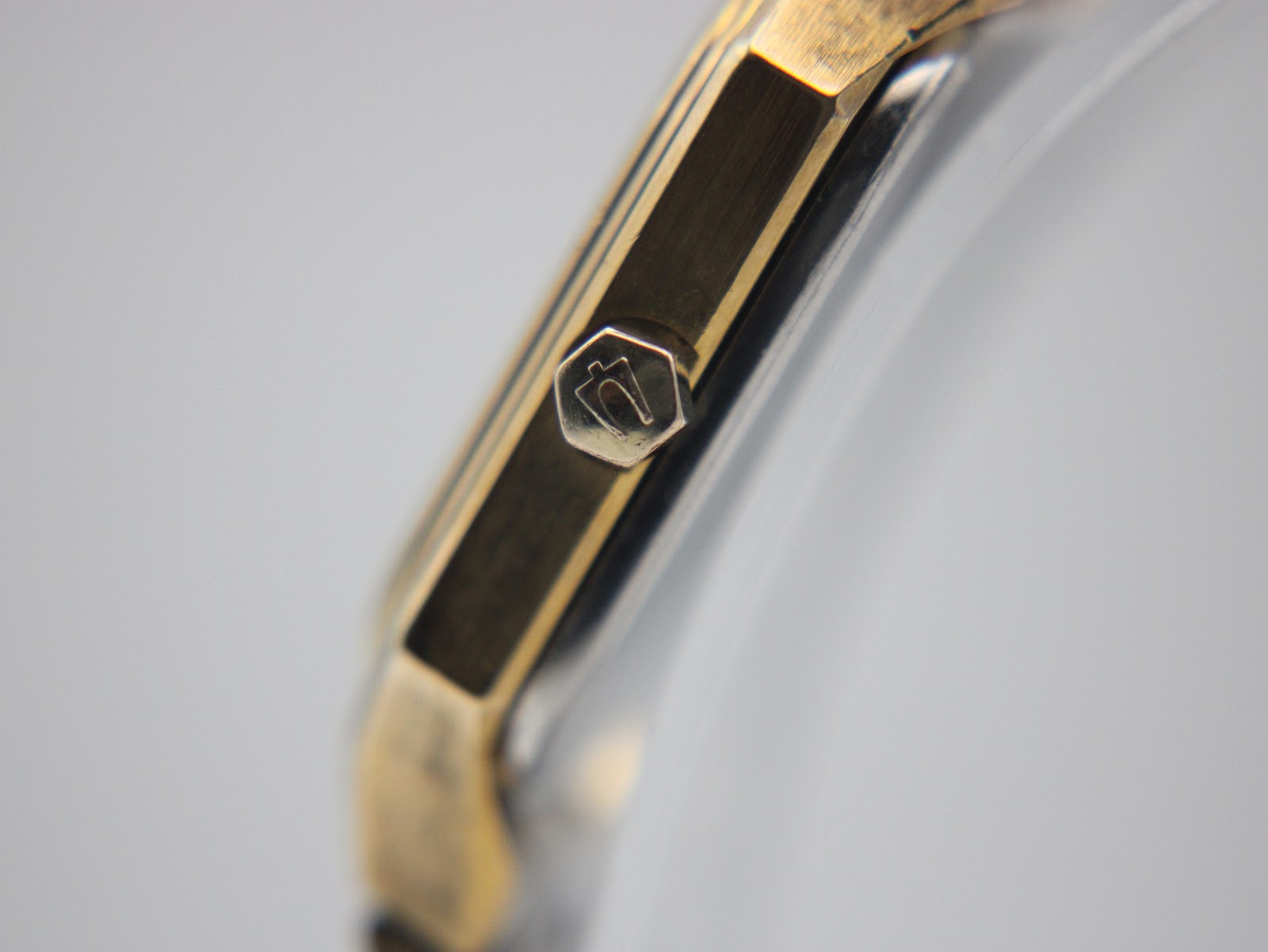 Close-up of the hexagonal crown, featuring the distinct Bulova tuning fork logo.