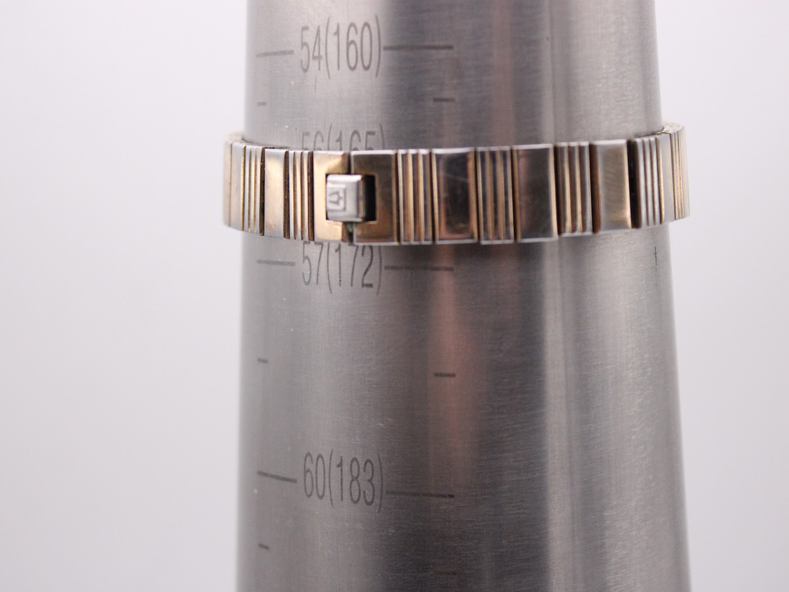 Bulova watch bracelet on a sizing cone, indicating a maximum wrist fit of approximately 172mm.