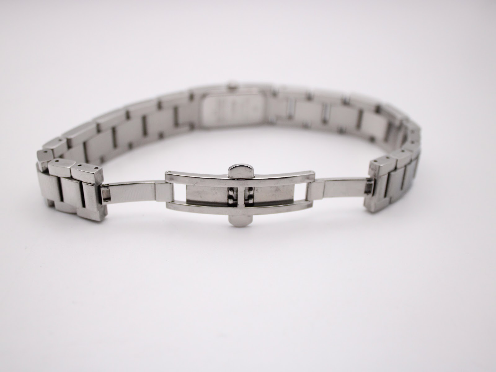 Full view of the open butterfly deployment clasp on the stainless steel bracelet.