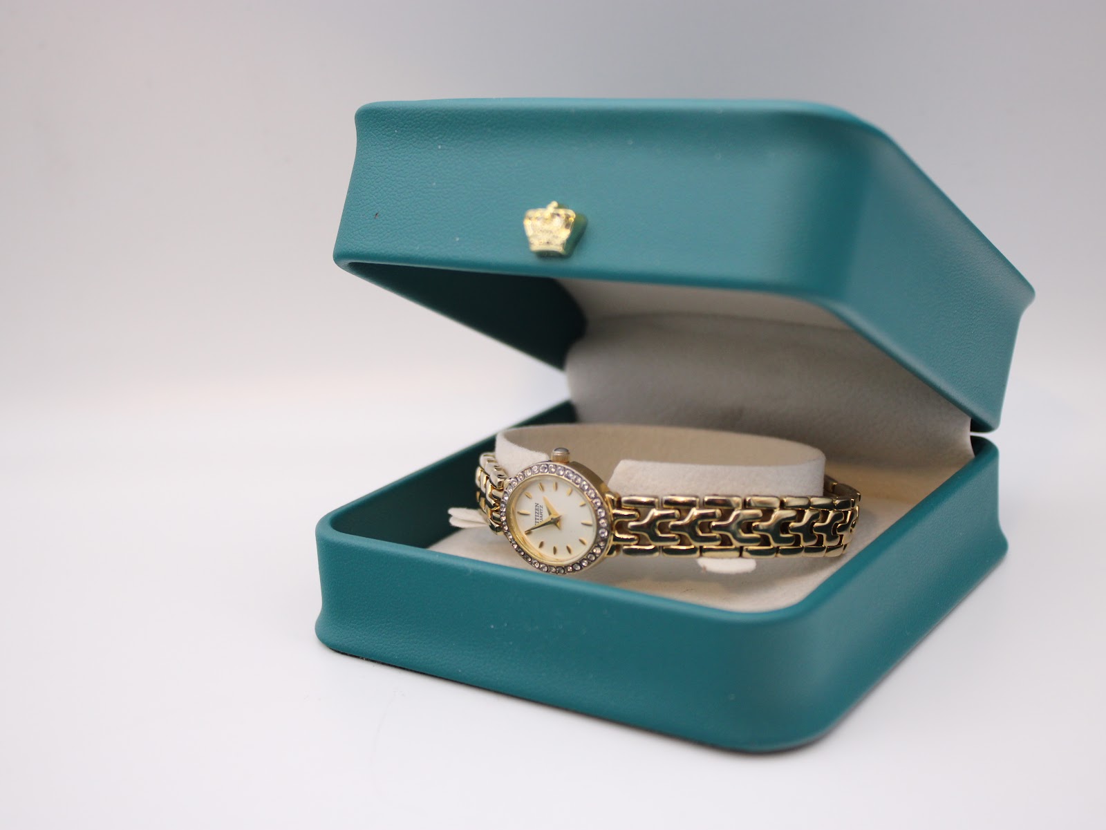The Citizen watch presented in a generic green display box, highlighting its elegant appearance.