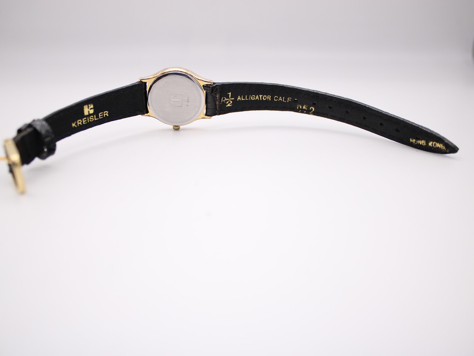 Back view of the Tissot watch strap, showing 'KREISLER' and 'ALLIGATOR CALF' text.
