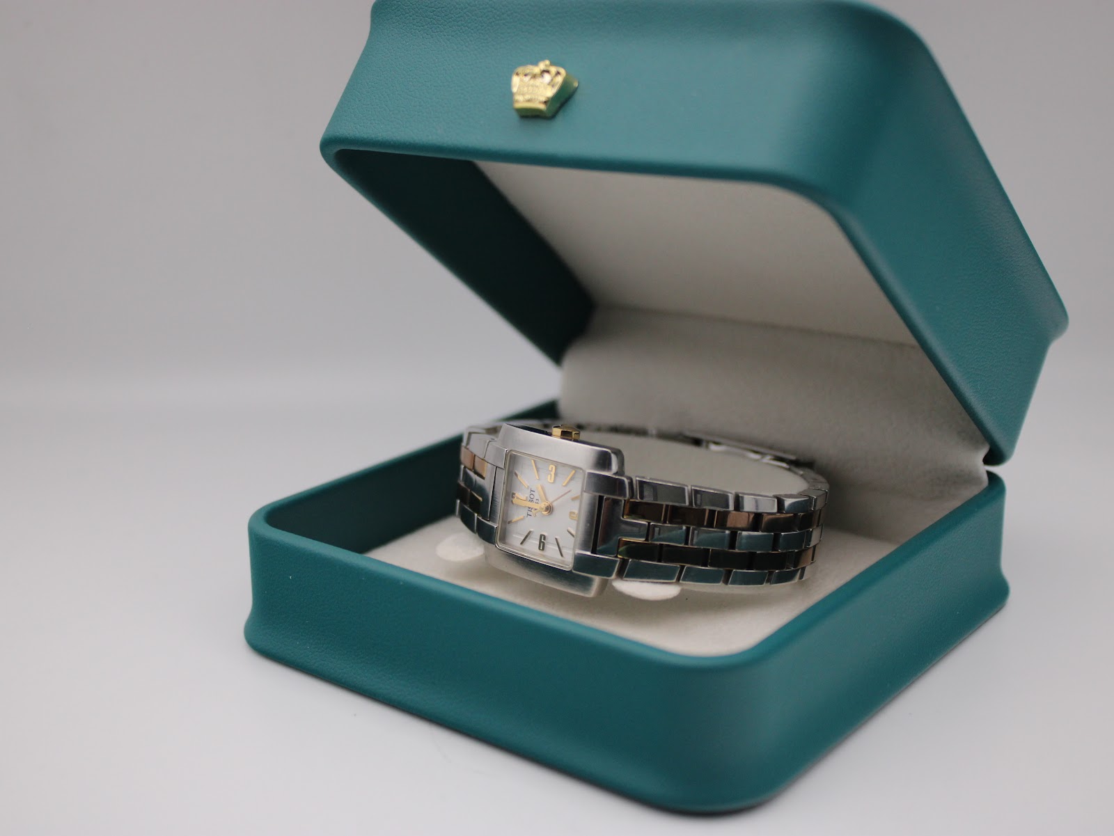 The Tissot T-Trend watch presented inside a green, non-original display box.