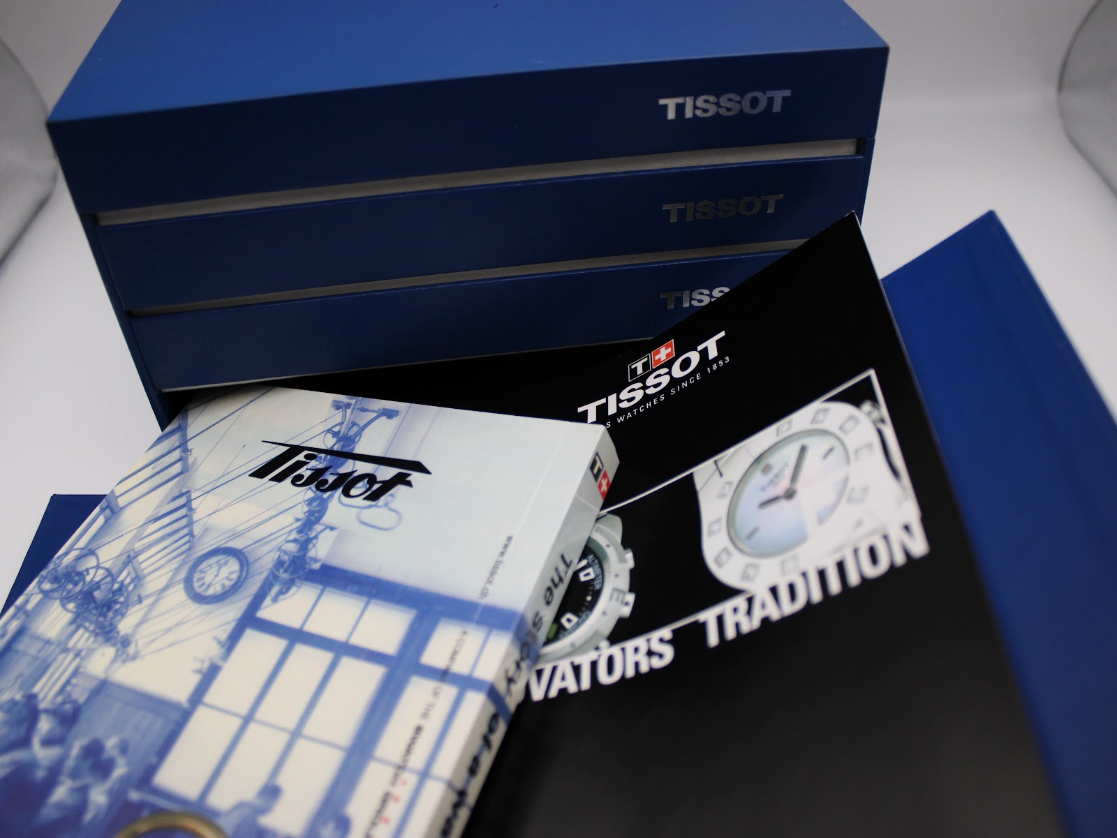 A collection of the original Tissot manuals and history booklets included with the watch.